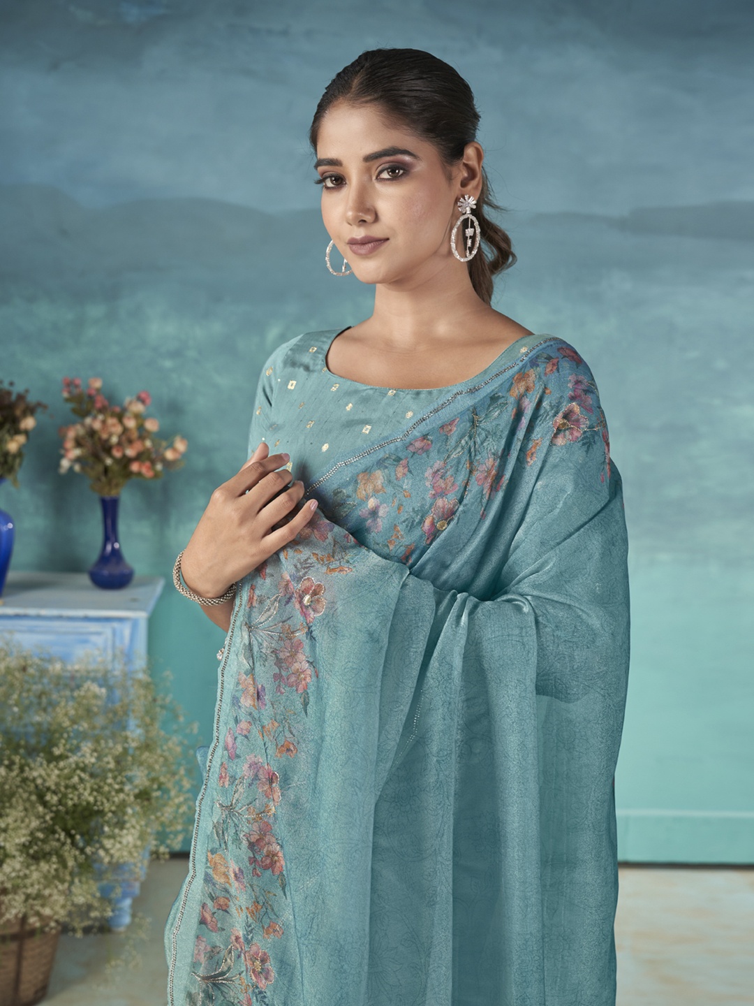

Ethnielle Floral Printed Tissue Saree With Beads and Stones, Turquoise blue