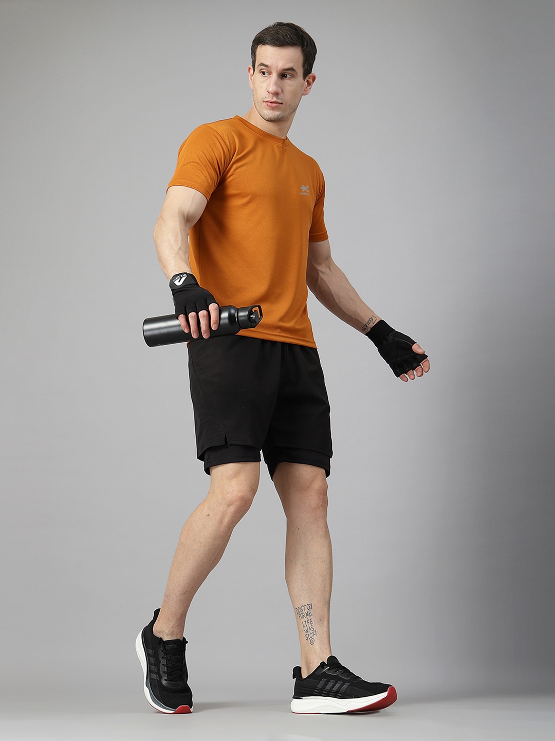 

HRX by Hrithik Roshan Men Solid Round Neck T-shirt, Rust