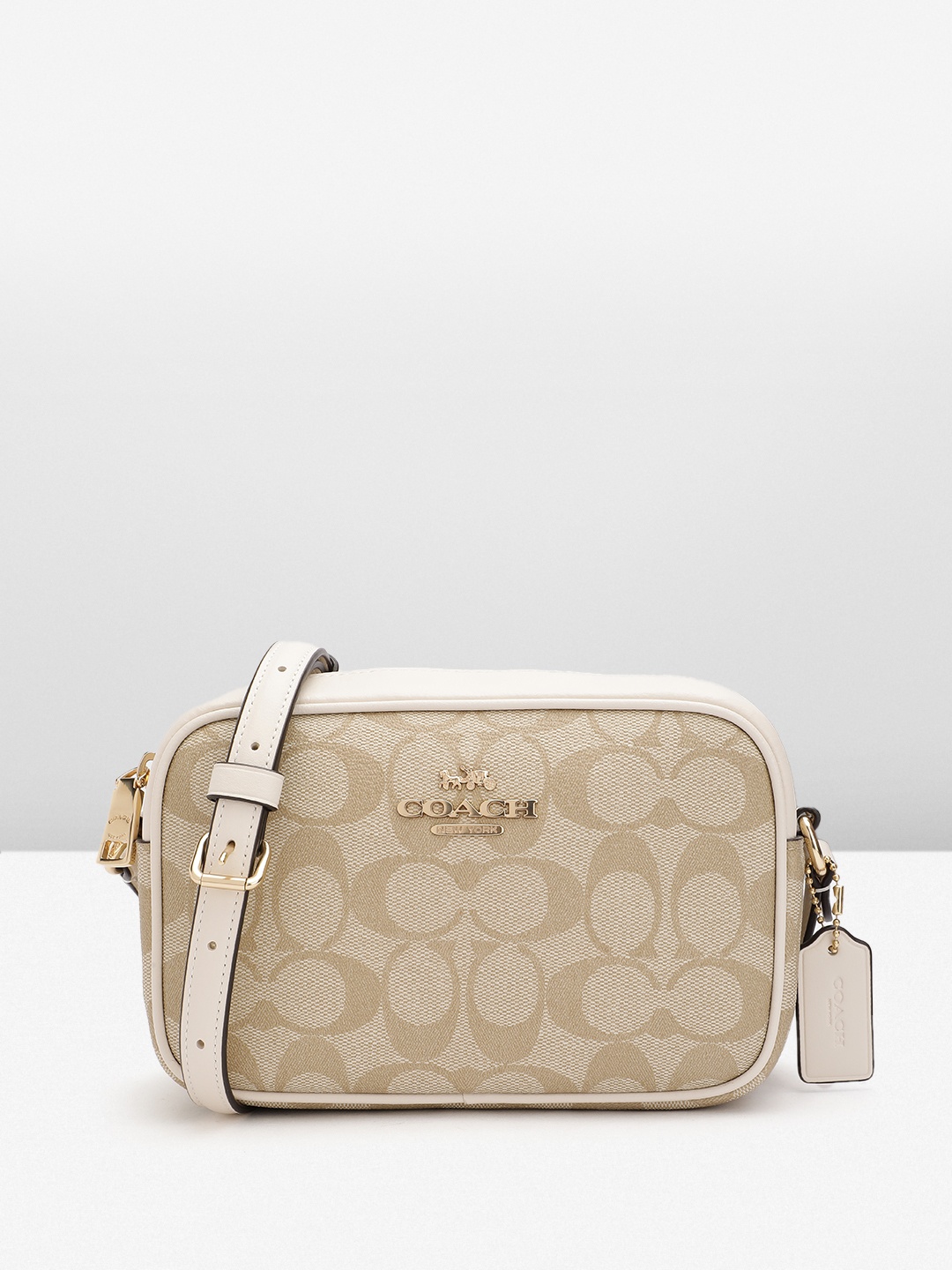 

Coach Canvas Brand Logo Textured Structured Sling Bag, Beige