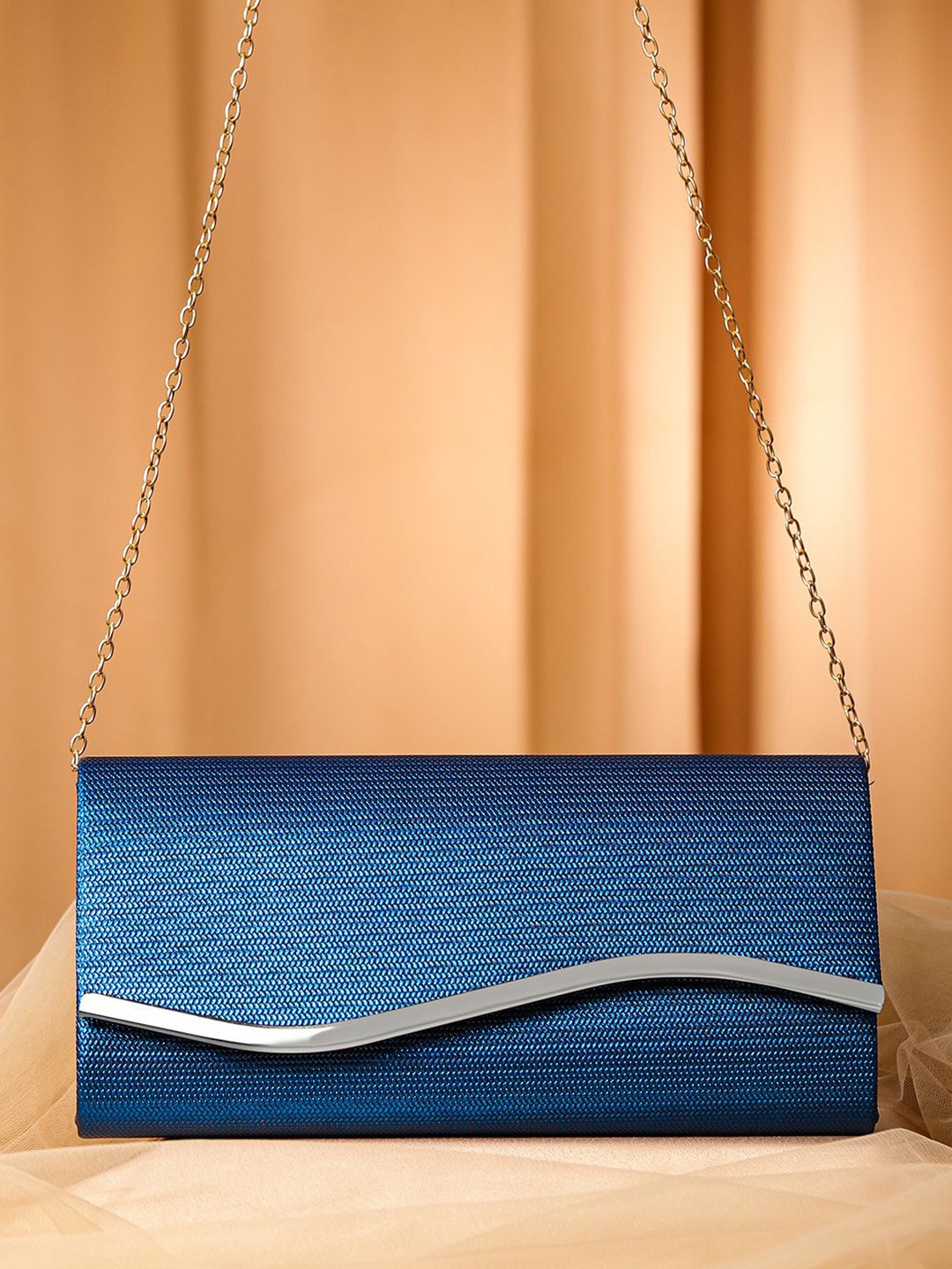 

Rubans Blue Sapphire Glossy Textured Clutch with Silver Tone Wavy Accent & Chain