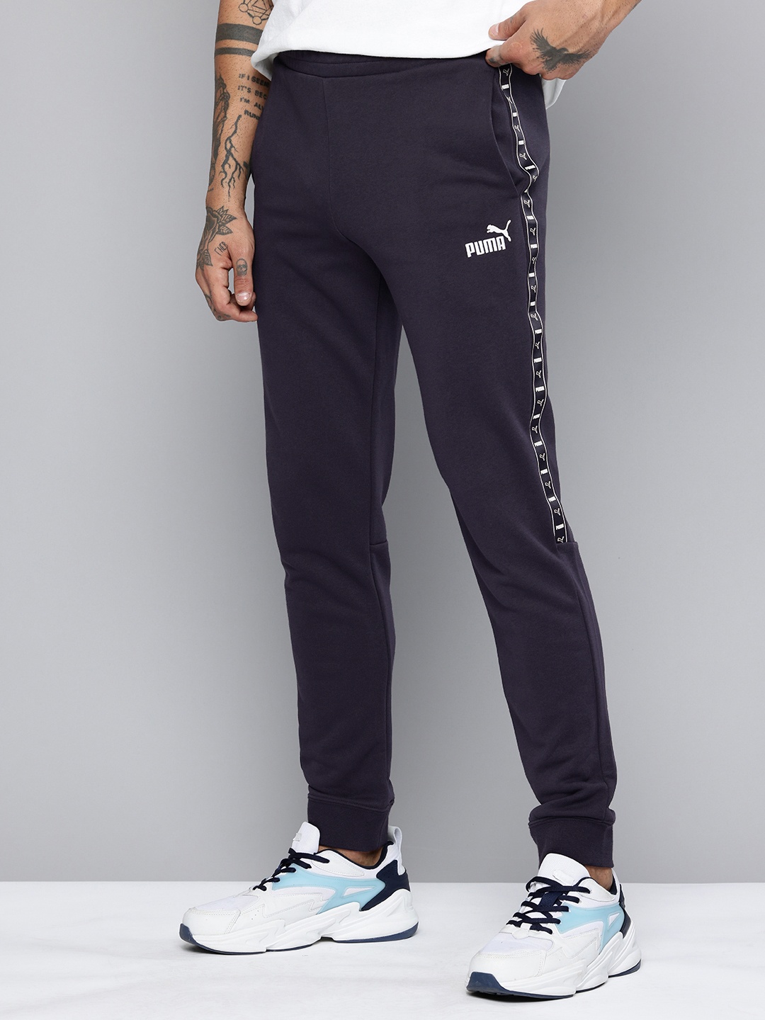 

Puma Men Brand Logo Tape Detailed Joggers, Navy blue