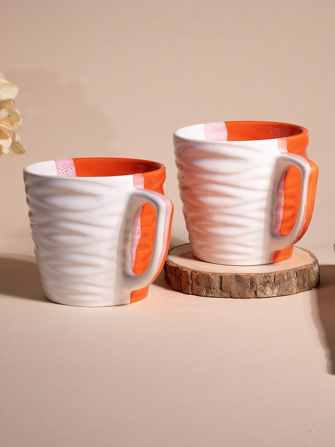 

Storepedia White & Orange Colored 2 Pieces Textured Ceramic Glossy Cups 150ml Each