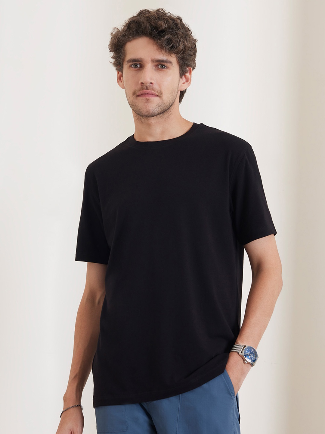 

Bombay Shirt Company Men Solid Round Neck T-shirt, Black