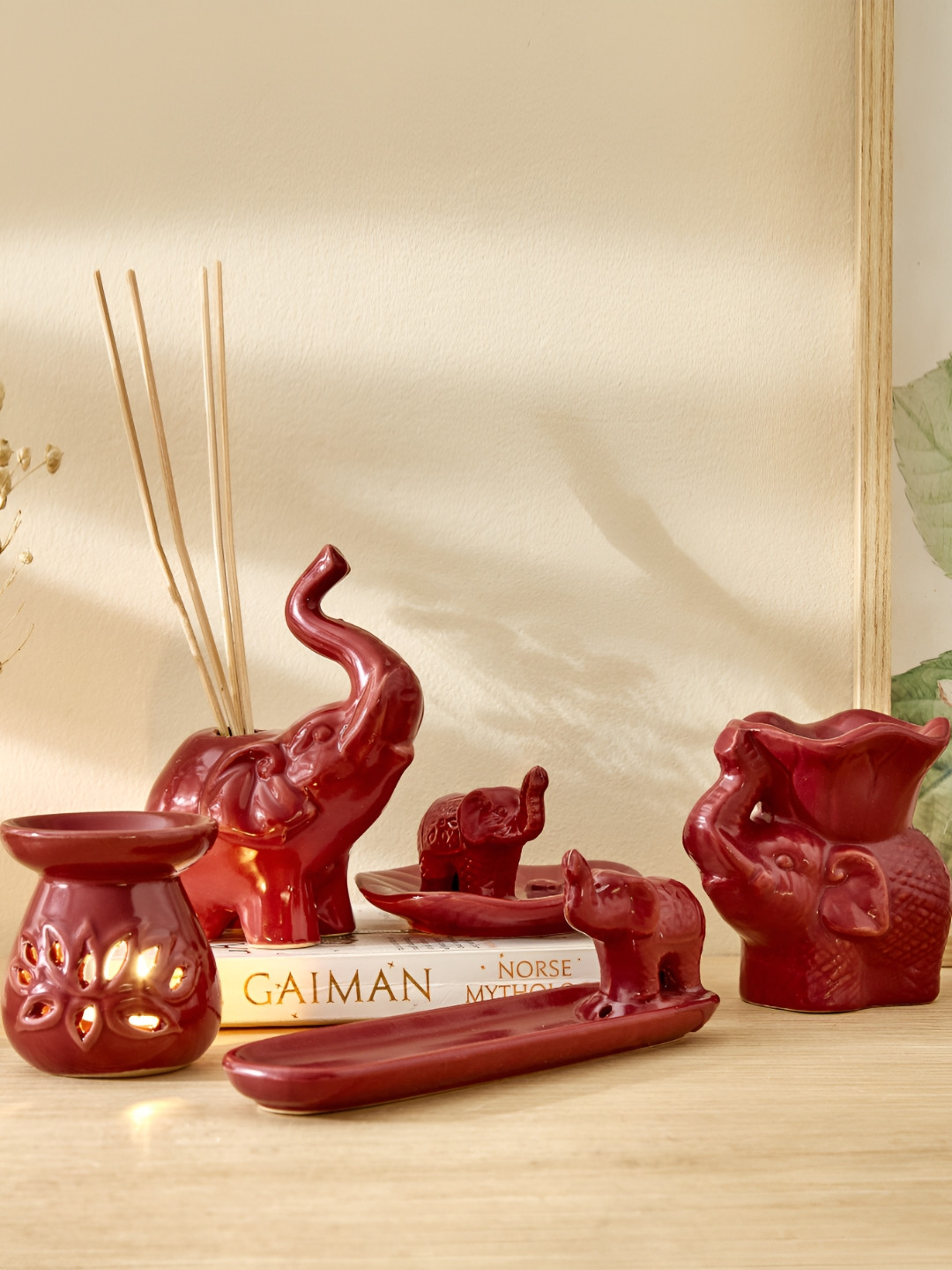 

Home Centre Red Glossy Garnet Serene Ceramic Elephant Oil Burner