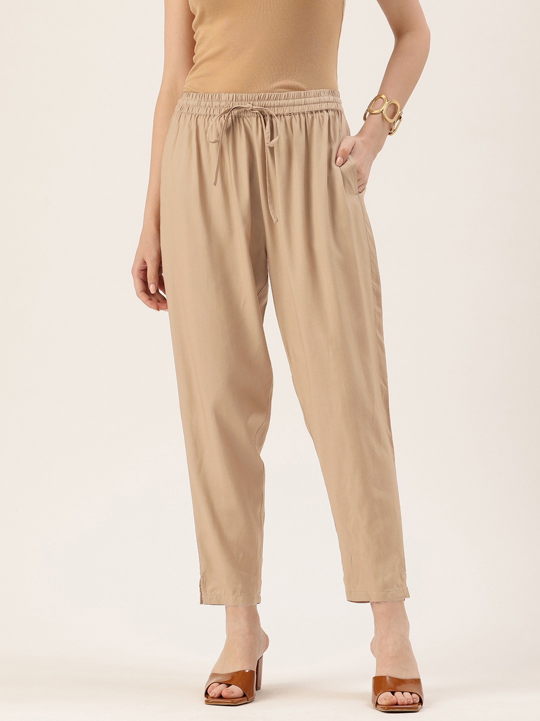 

AMUKTI Women Pencil Solid Trousers, Beige
