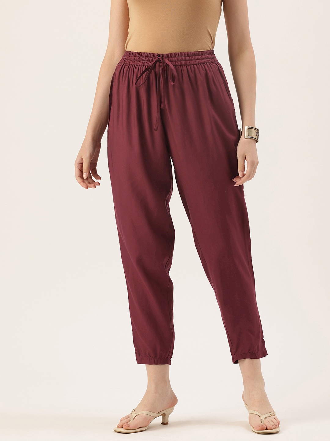 

AMUKTI Women Pencil Solid Trousers, Maroon