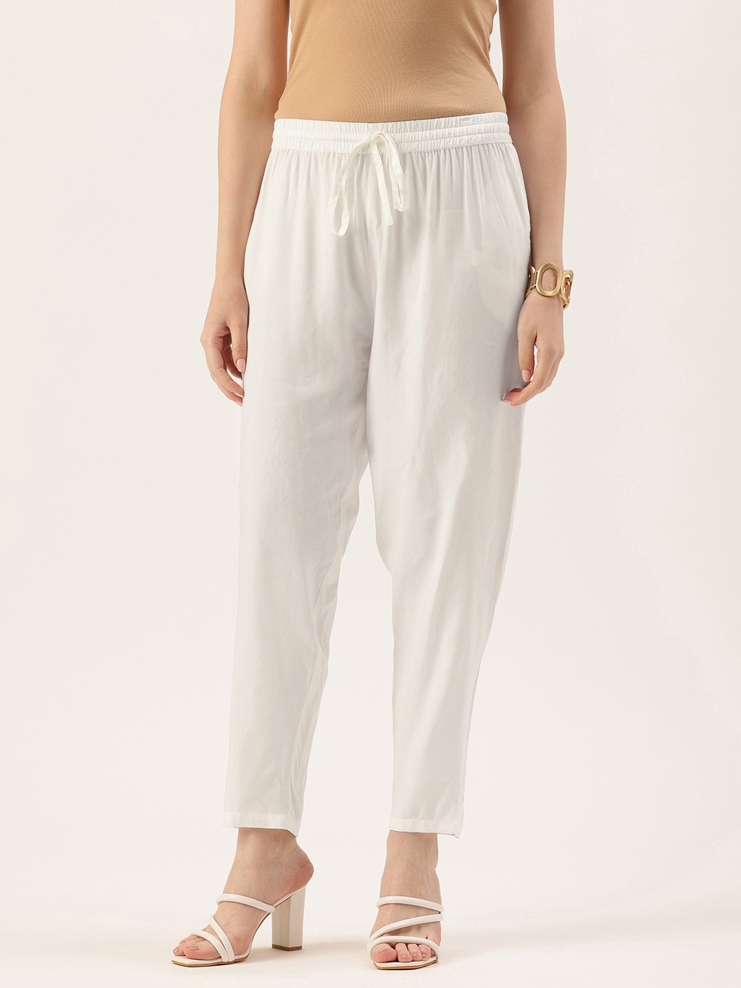 

AMUKTI Women Pencil Solid Trousers, White