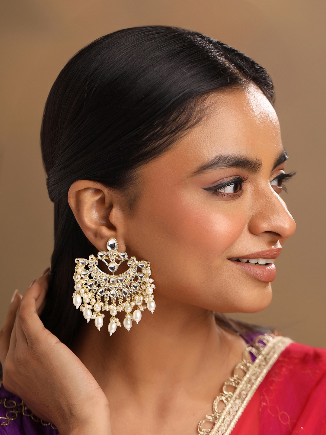 

Yellow Chimes Gold-Plated Kundan Studded Crescent Shaped Chandbalis Earrings