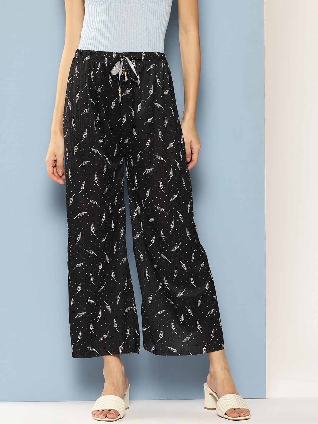 

Aarika Women Floral Printed Flared Palazzos, Black