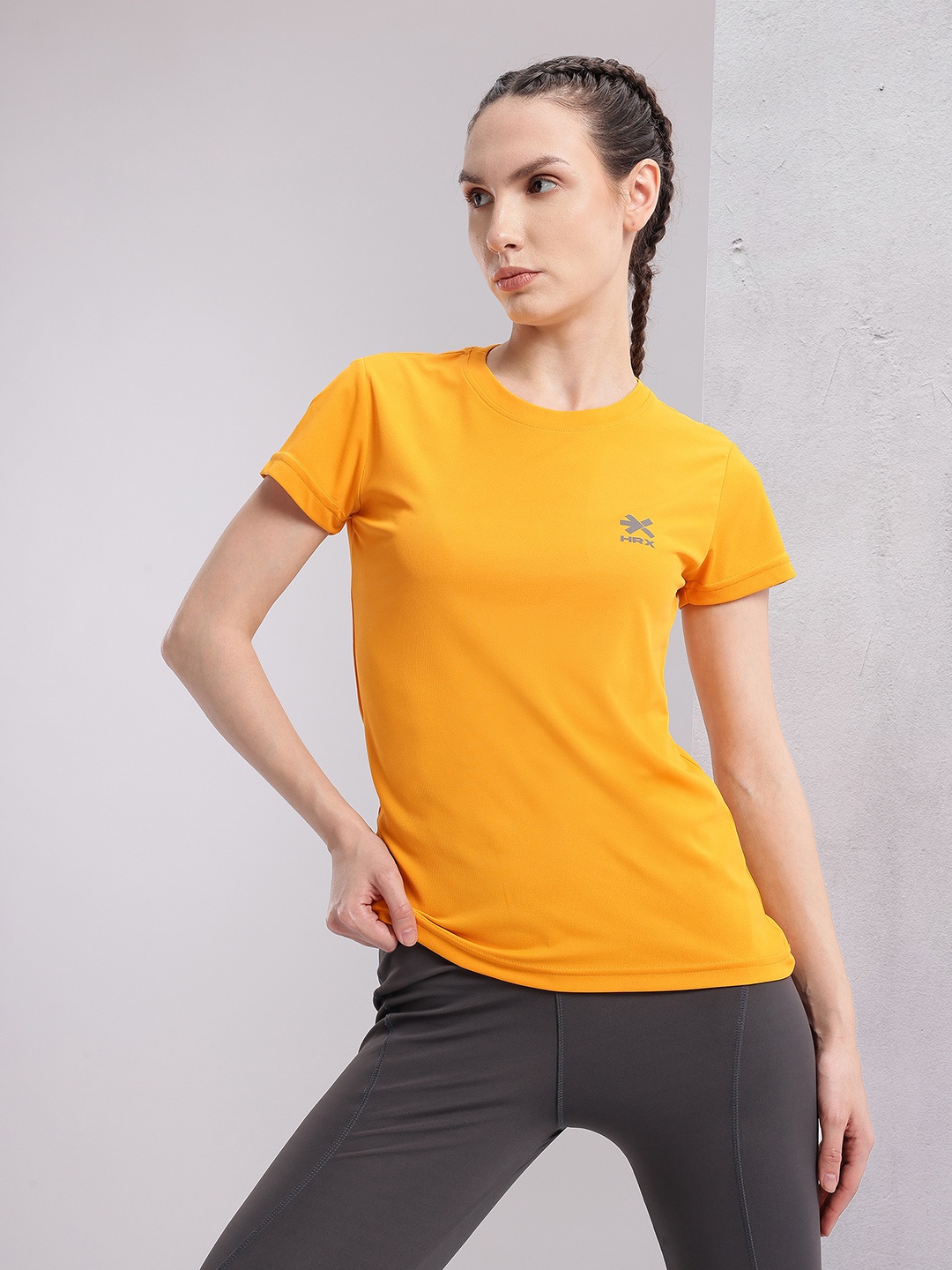 

HRX by Hrithik Roshan Solid T-shirt with Brand Logo Detail, Orange