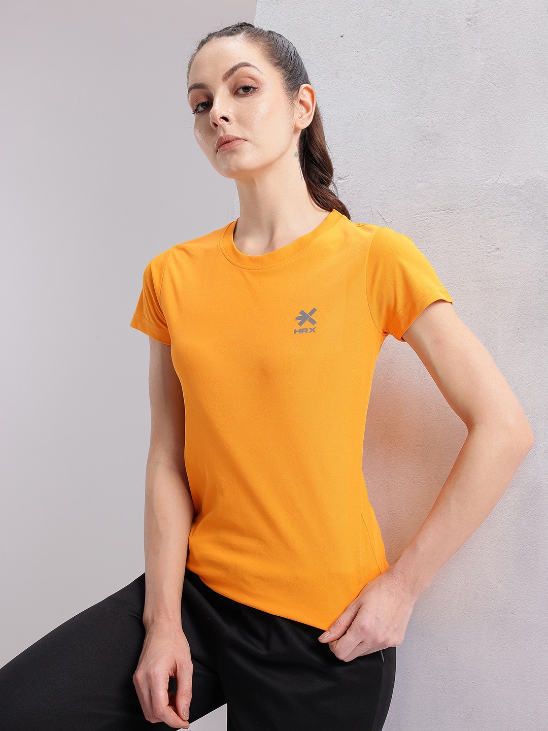 

HRX by Hrithik Roshan Solid T-shirt with Brand Logo Detail, Orange