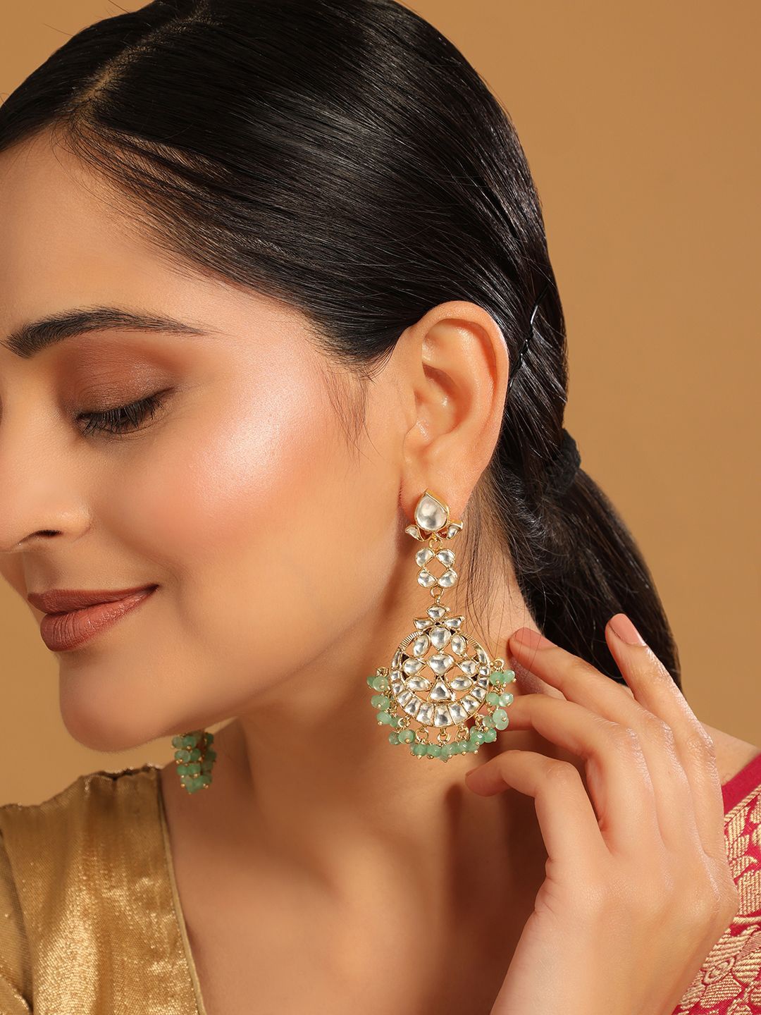 

Yinara 22K Gold Plated Kundan Stone Studded Contemporary Shaped Chandbalis