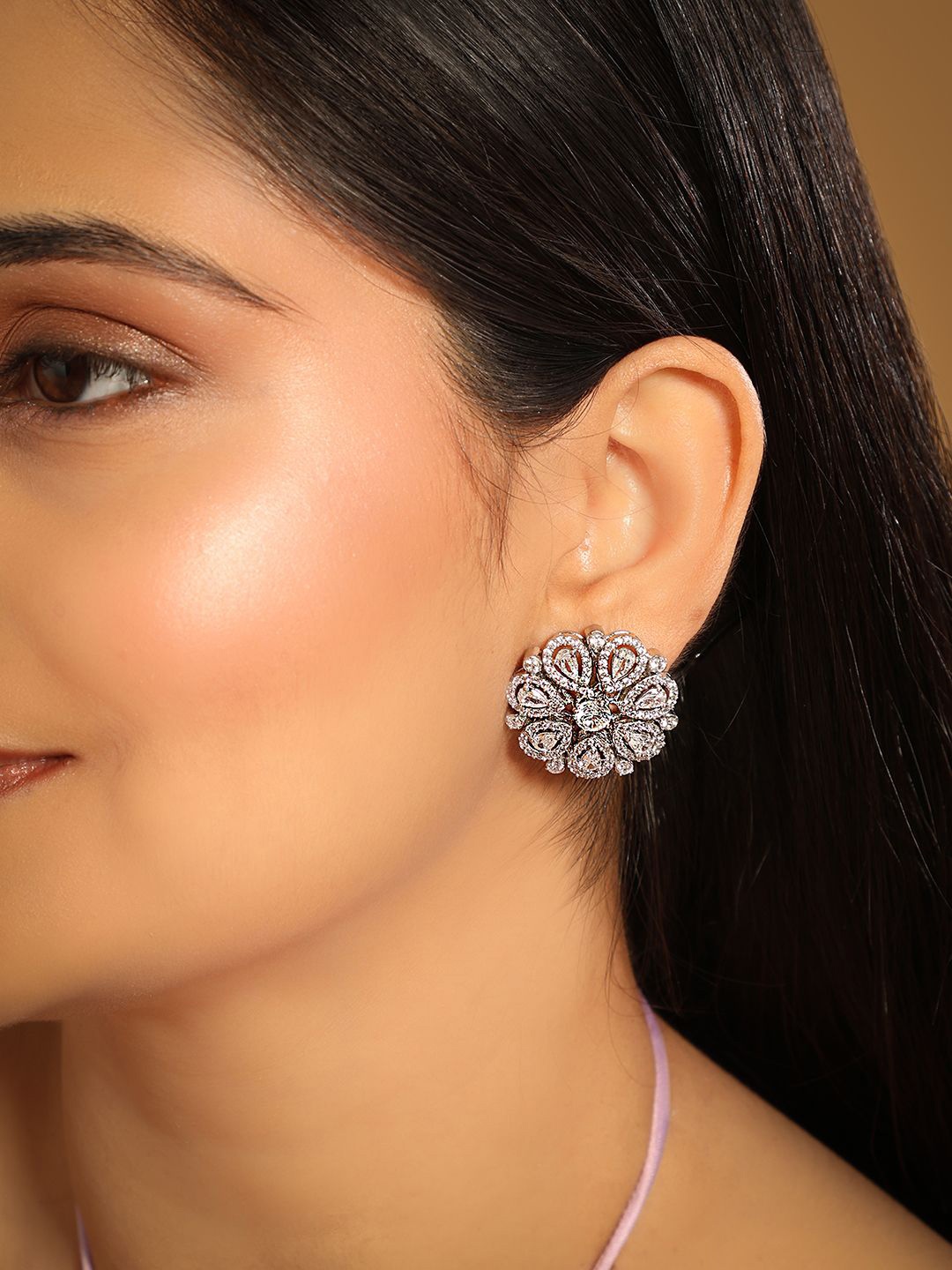 

Yinara Rhodium-Plated Cubic Zirconia Studded Floral Shaped Studs, Silver