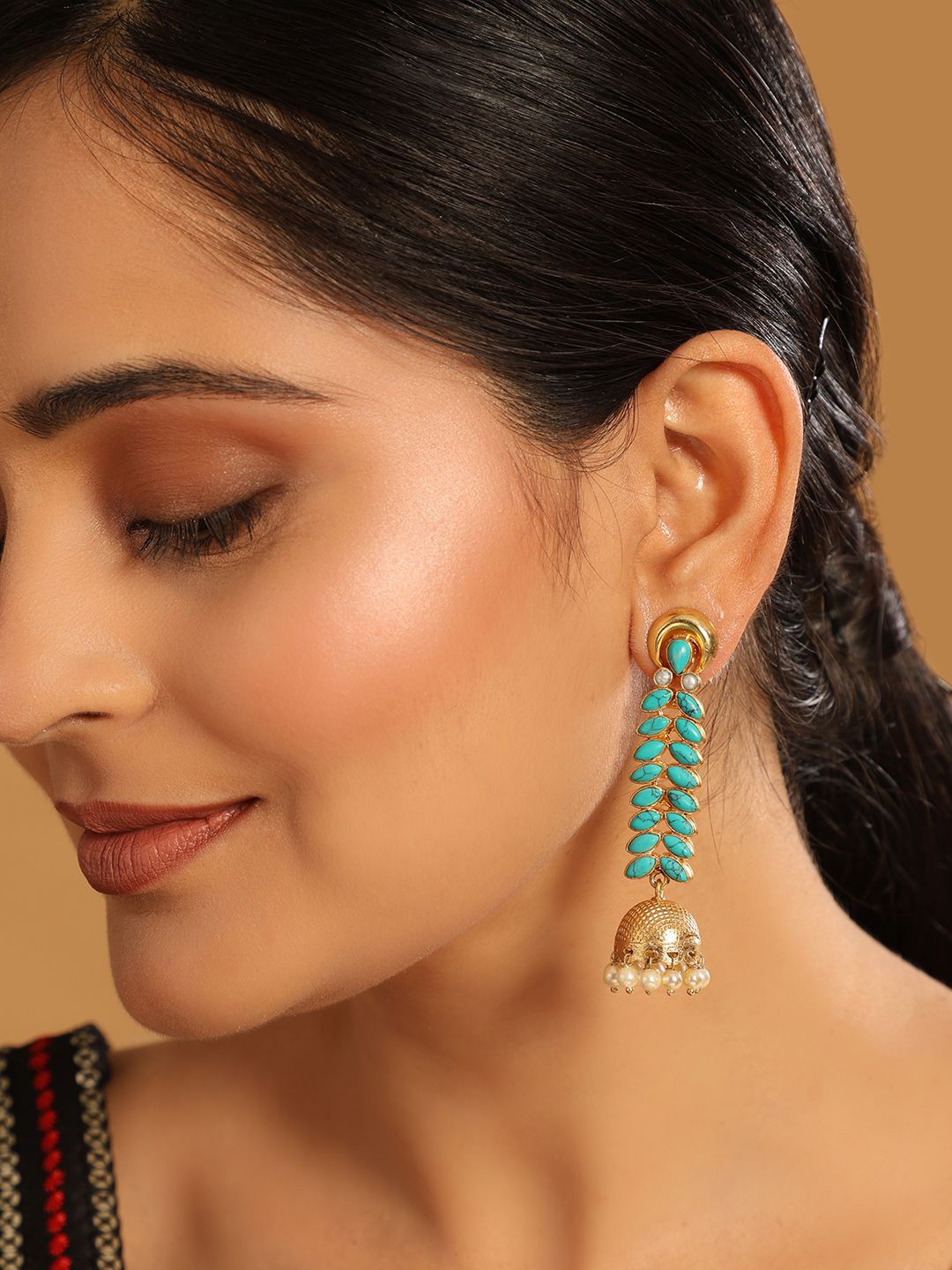 

Yinara 22K Gold Plated Pearl & Turquoise Stone Studded Contemporary Shaped Jhumkas