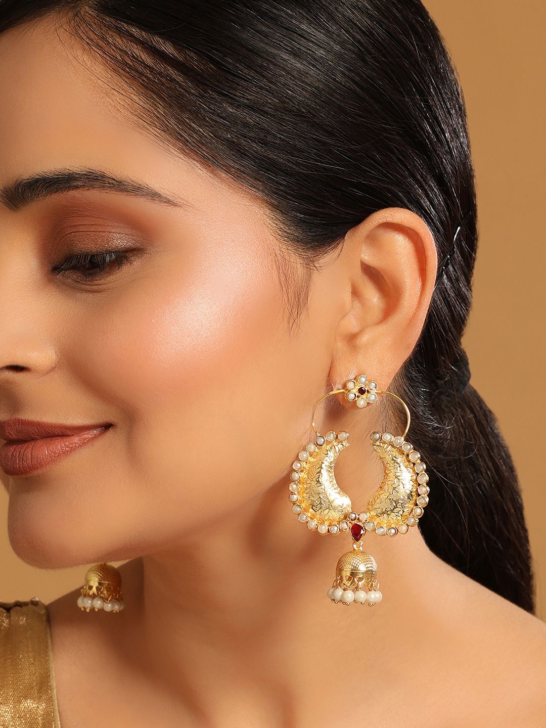 

Yinara 22K Gold Plated Pearls Studded Contemporary Shaped Jhumkas