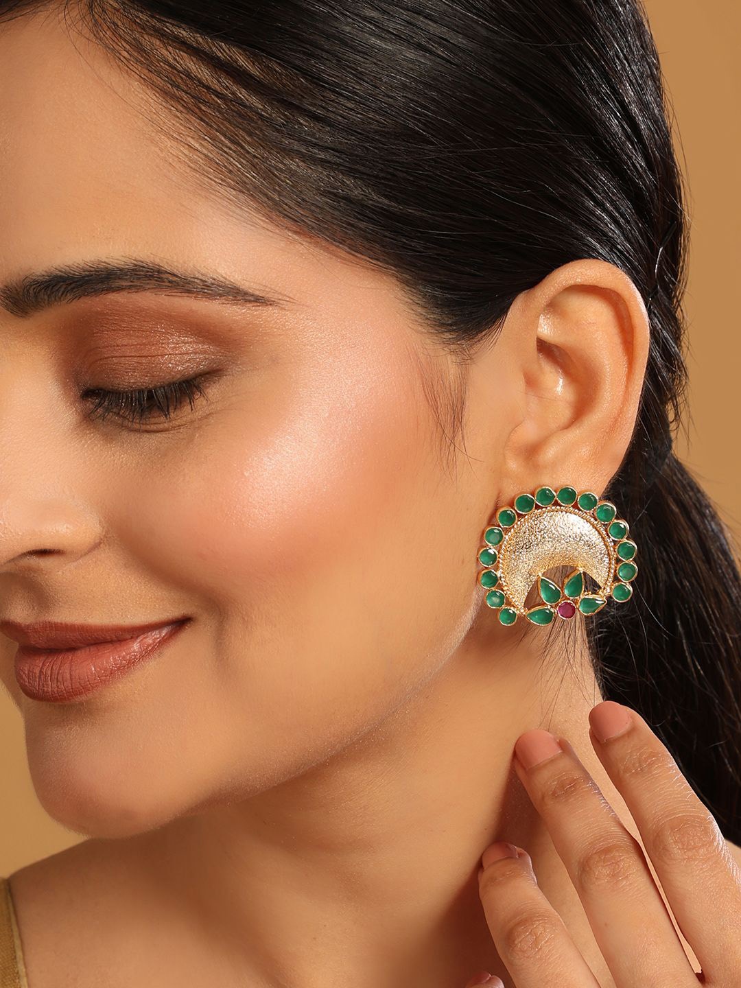 

Yinara 22K Gold Plated Faux Emerald Stone Studded Contemporary Shaped Studs