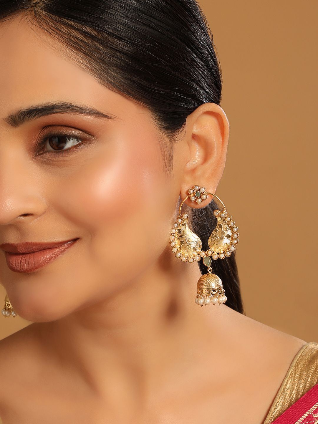 

Yinara 22K Gold Plated Crystals Studded Contemporary Shaped Jhumkas