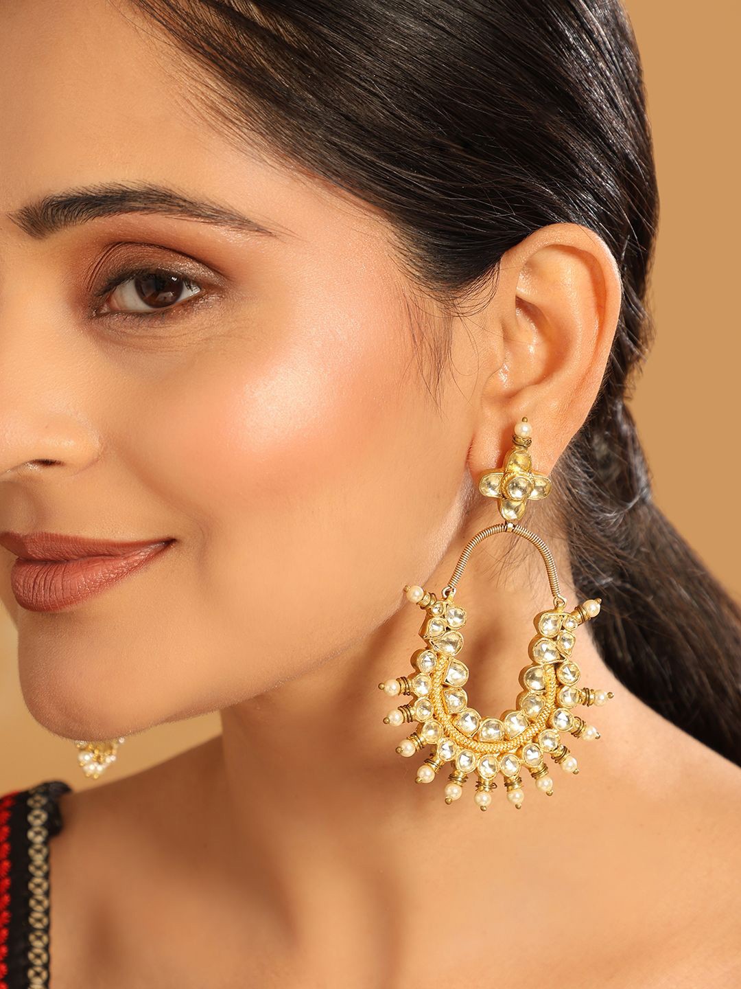 

Yinara 22K Gold Plated Kundan Studded Contemporary Shaped Drop Earrings