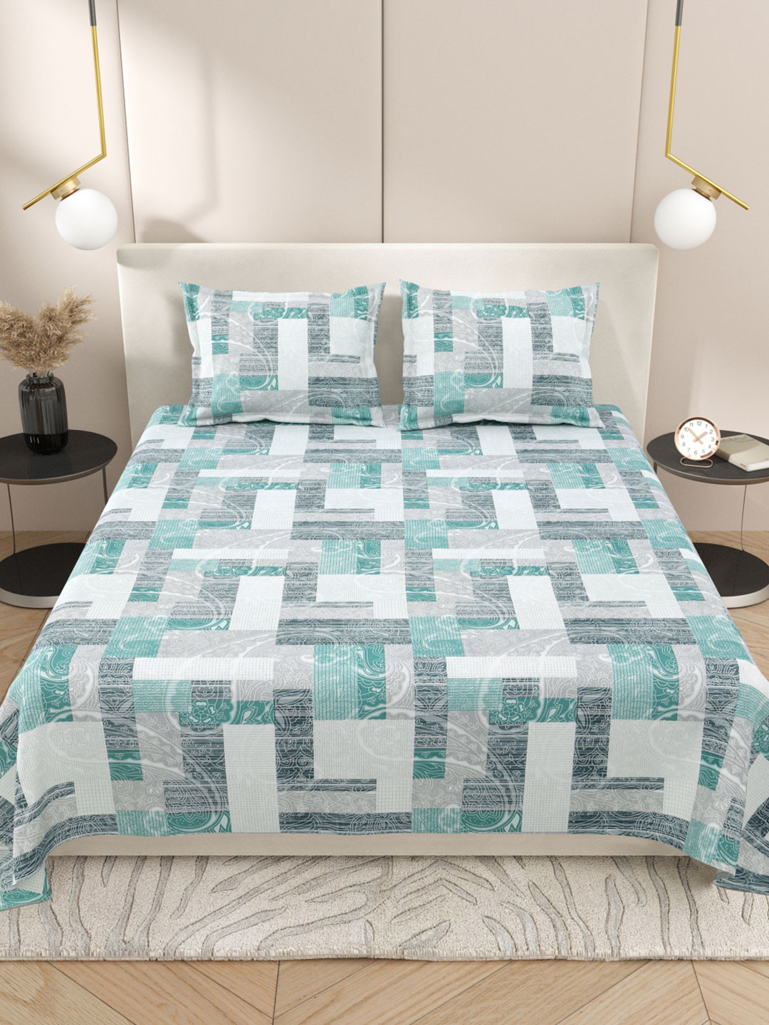 

Myntra Elegant Homes White & Turquoise Blue 220 TC King Bedsheet with 2 Pillow Covers