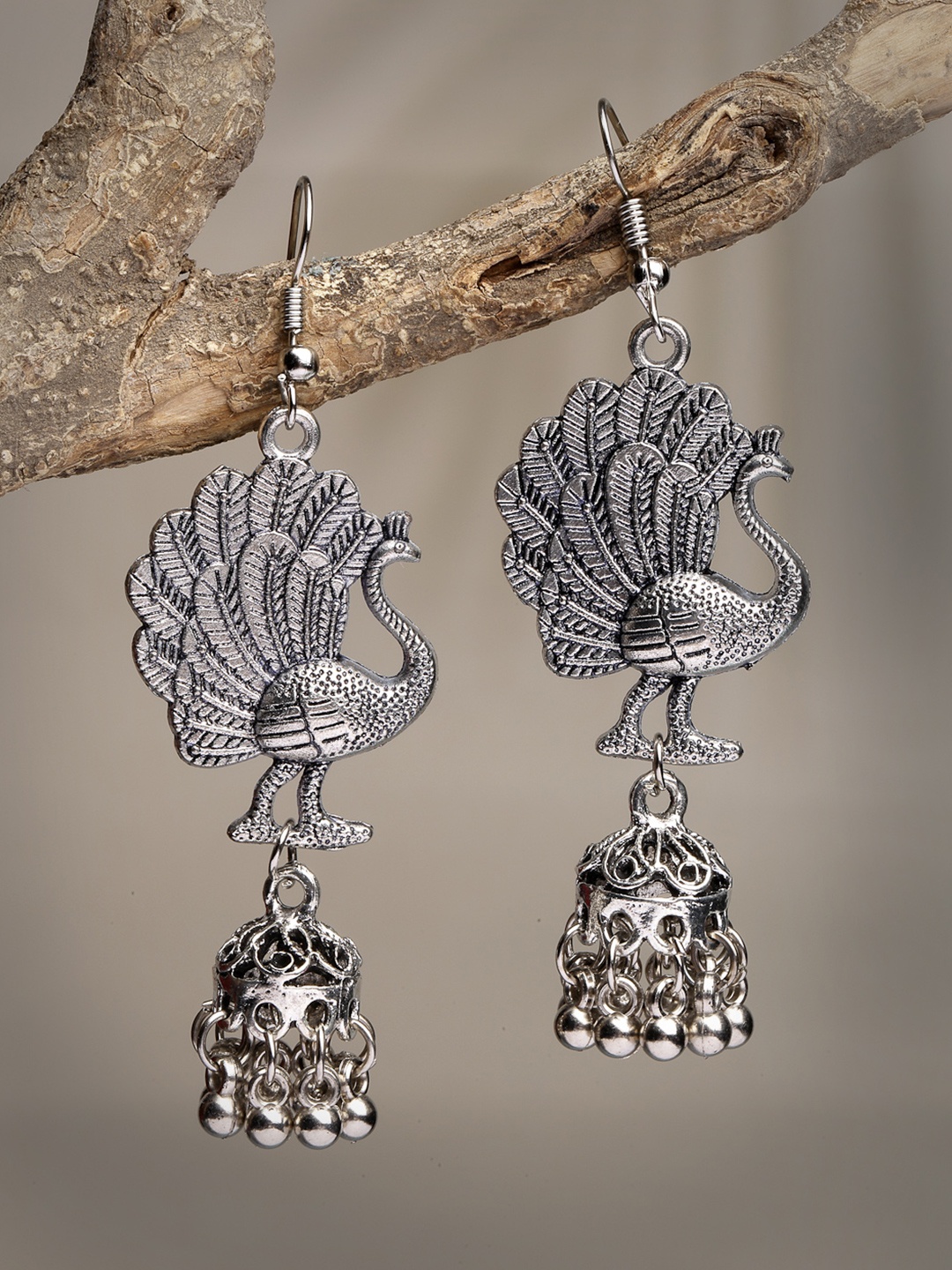 

Anouk Women Silver-Toned Peacock Desing German Silver Oxidised Dome Shaped Jhumka Earrings