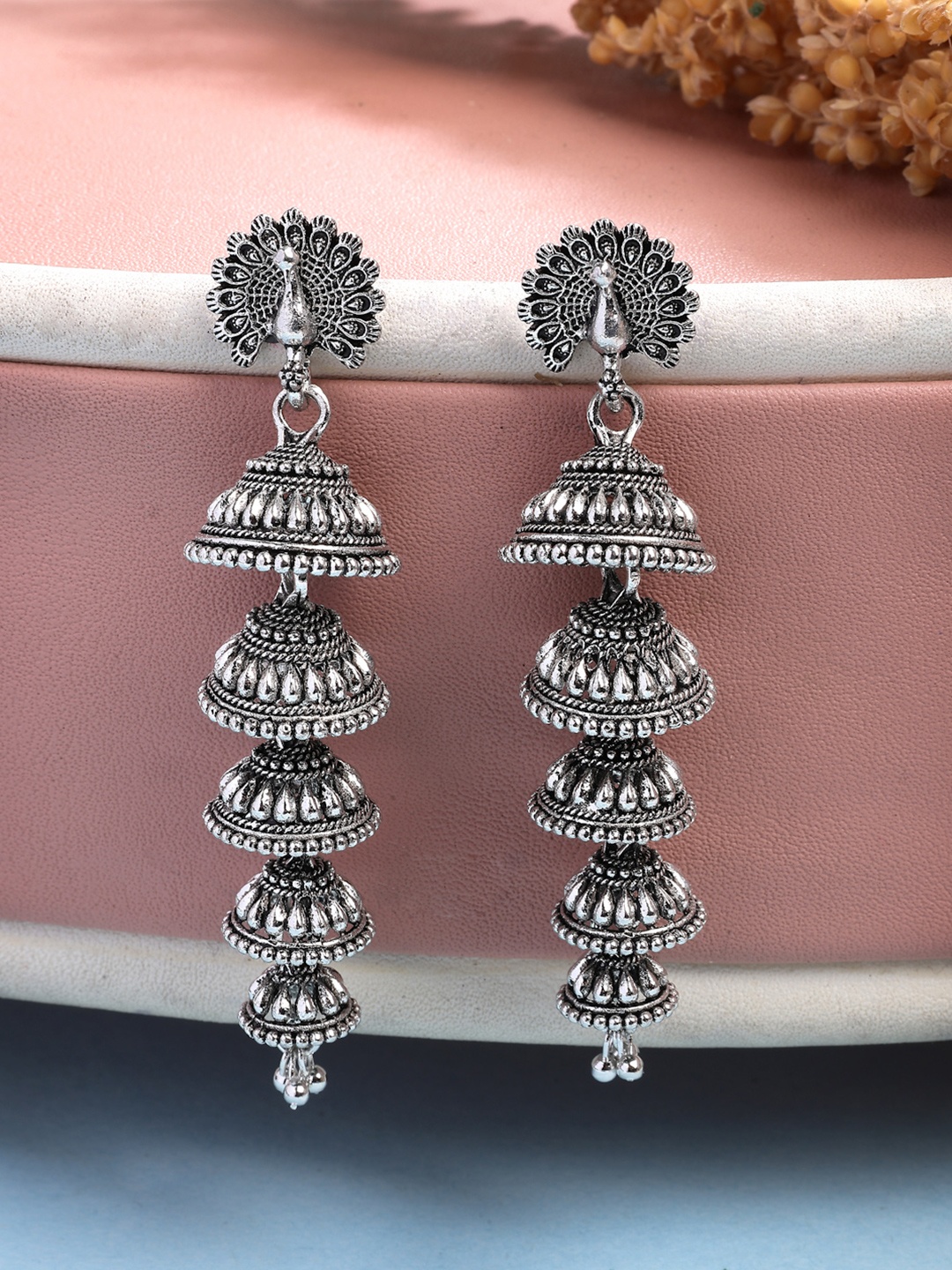 

Anouk Women Silver Plated Oxidised Peacock Design Layered Jhumka Earrings