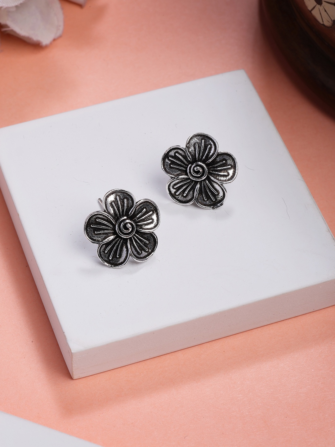 

Anouk Women Silver Plated Oxidized Floral Shape Stud Earrings