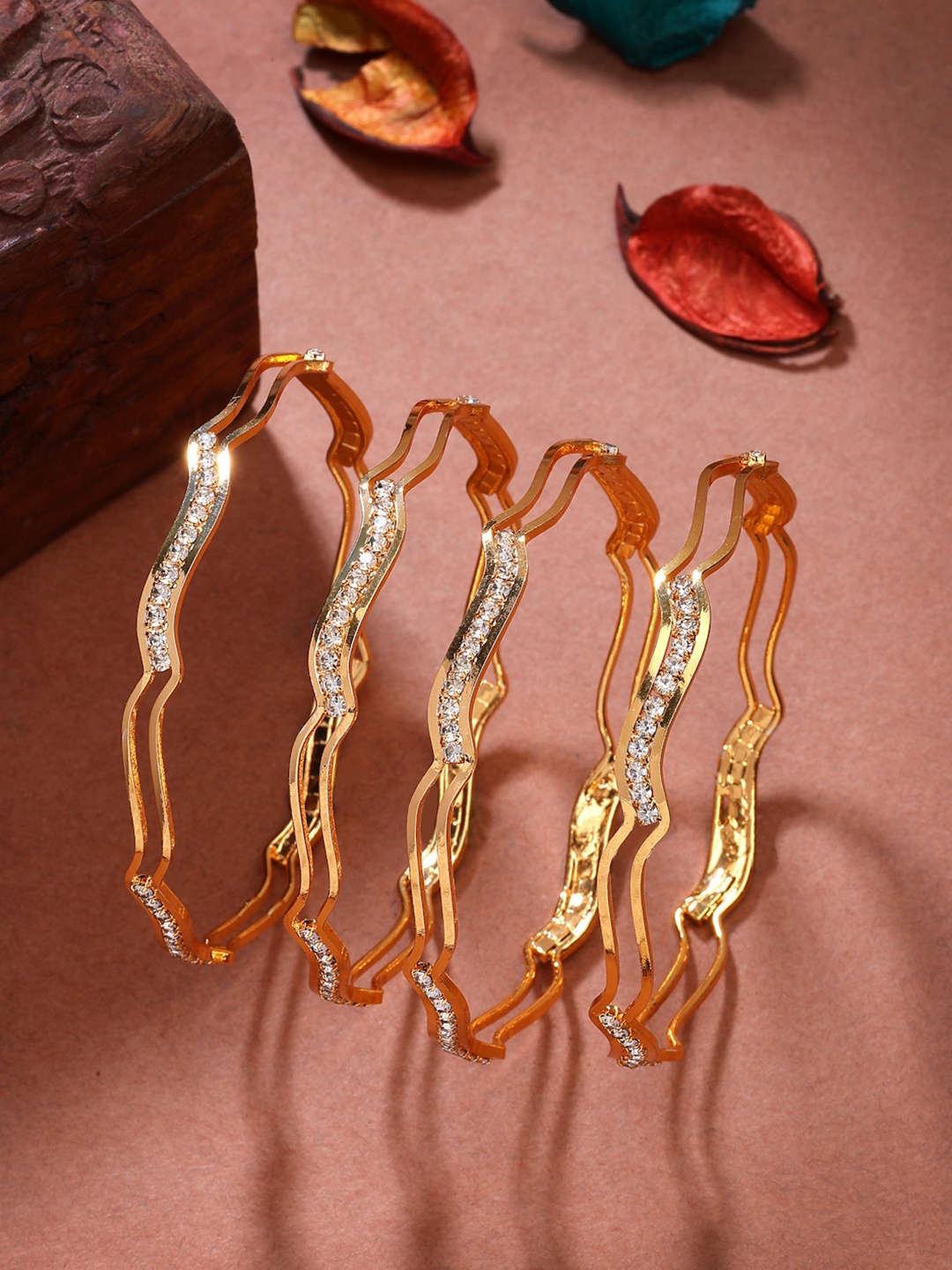 

Anouk Women Set of 4 Gold-Plated Cubic Zirconia Stone Studded Bangles