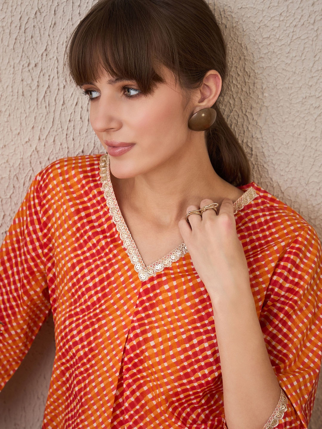 

Indo Era Leheriya Printed Pleated V-Neck Sequins Pure Cotton A-Line Kurta, Orange