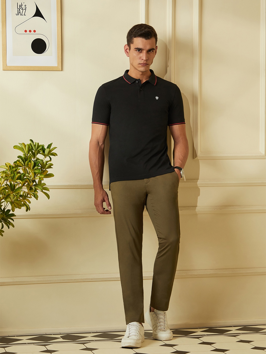 

Van Heusen Sport Men Black Solid Polo Collar T-shirt