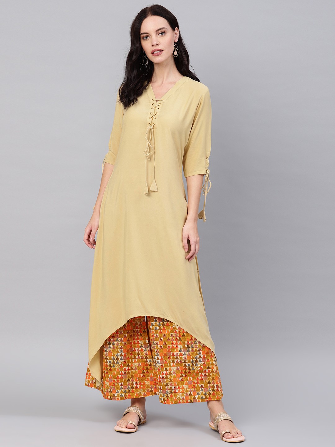 

GERUA Women Beige & Mustard Yellow Solid Kurta with Palazzos