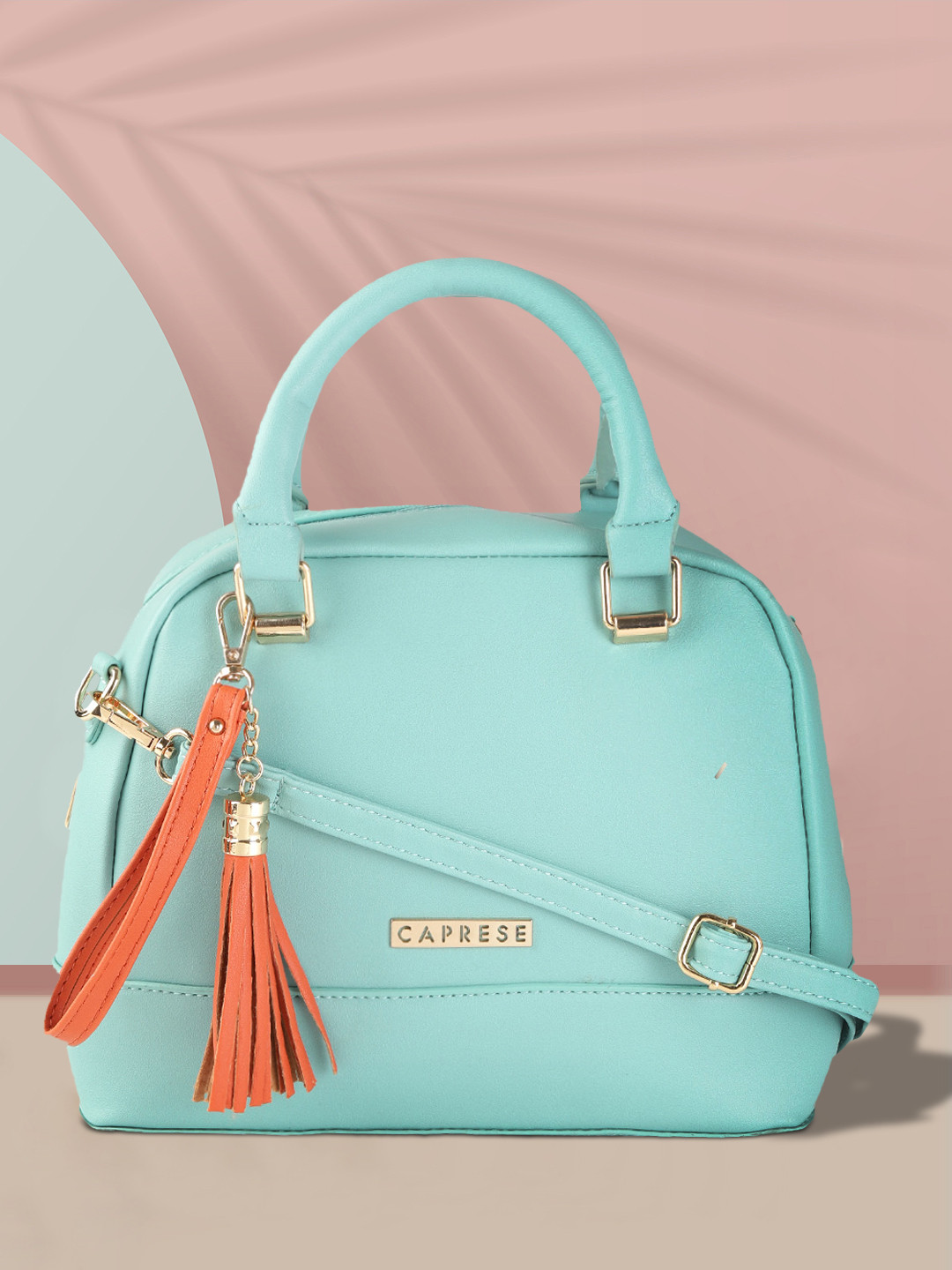 

Caprese Women Blue Solid Structured Handheld Bag with Tassels