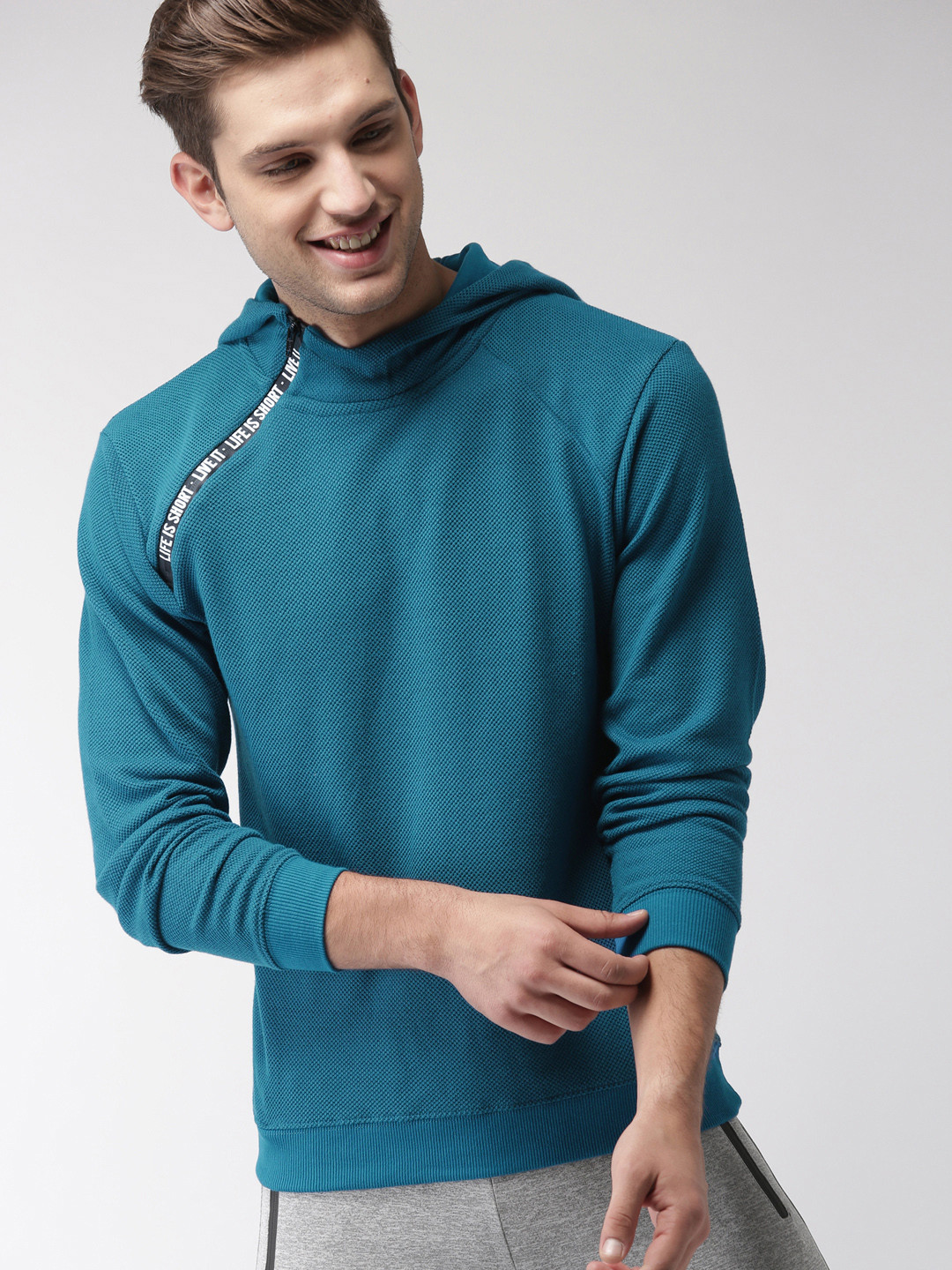 

Mast & Harbour Men Blue Self Design Hooded Sweatshirt