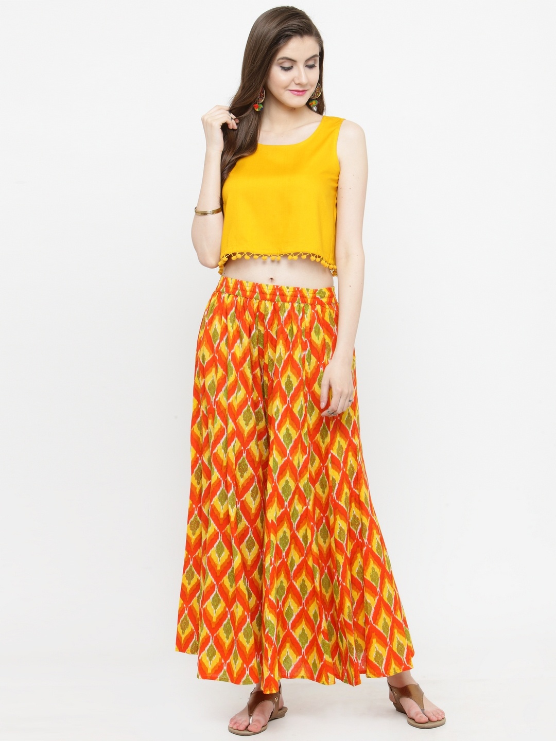 

Varanga Women Yellow & Orange Solid Top with Palazzos