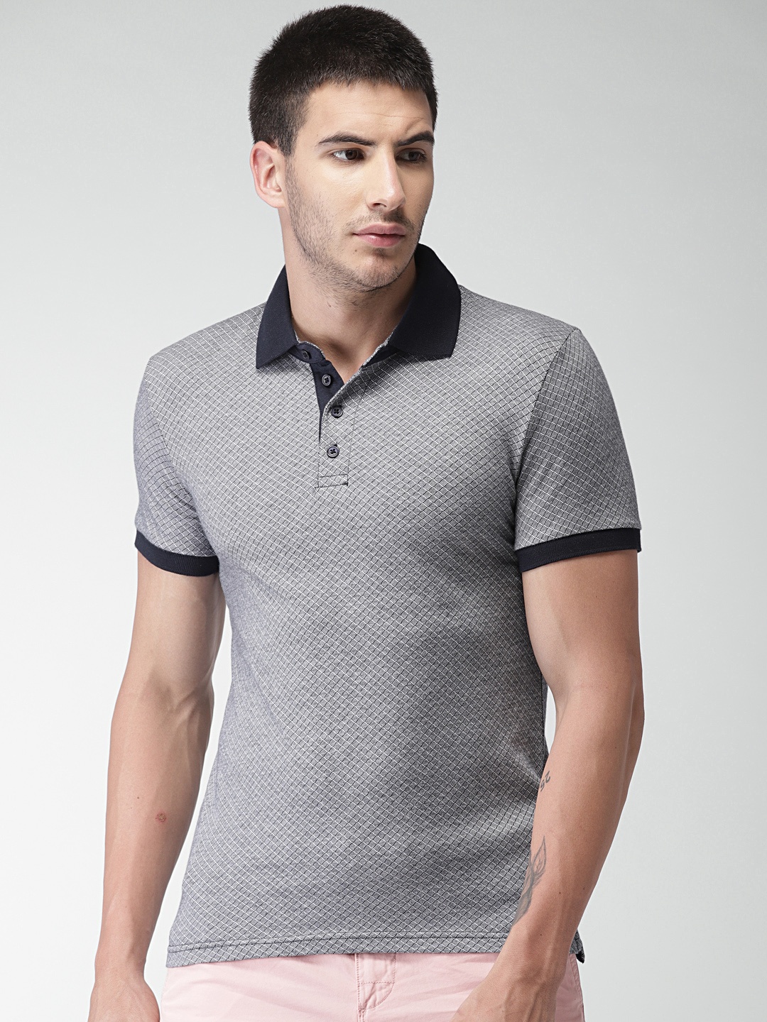 

Celio Men Navy Blue & White Printed Polo T-shirt