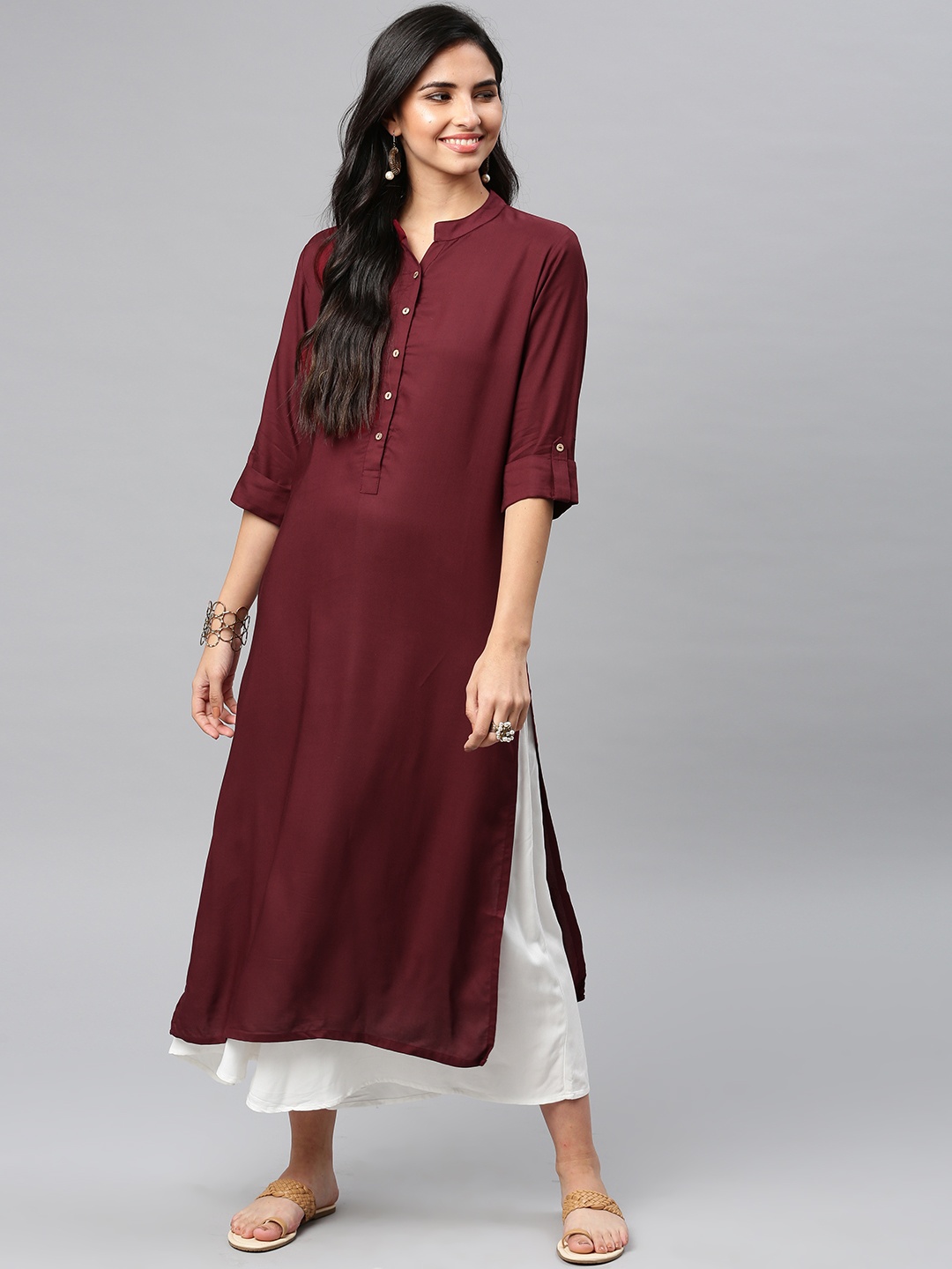 

Vishudh Women Maroon Solid Straight Kurta