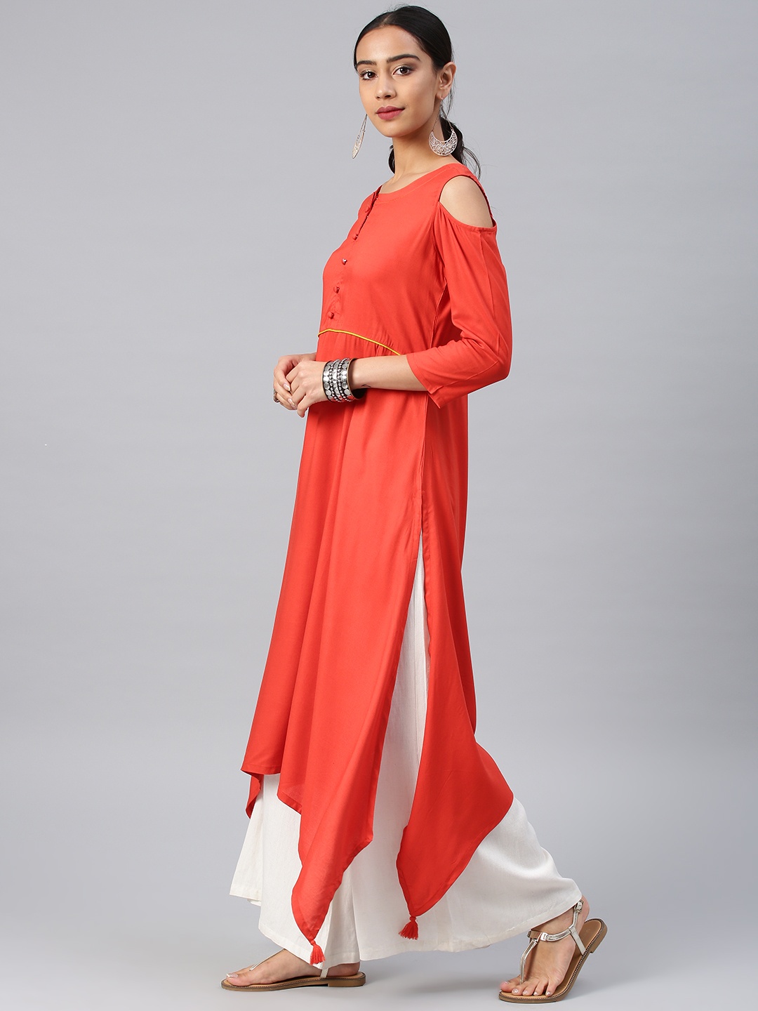 

Vishudh Women Orange Solid Asymmetric Hemline A-Line Kurta