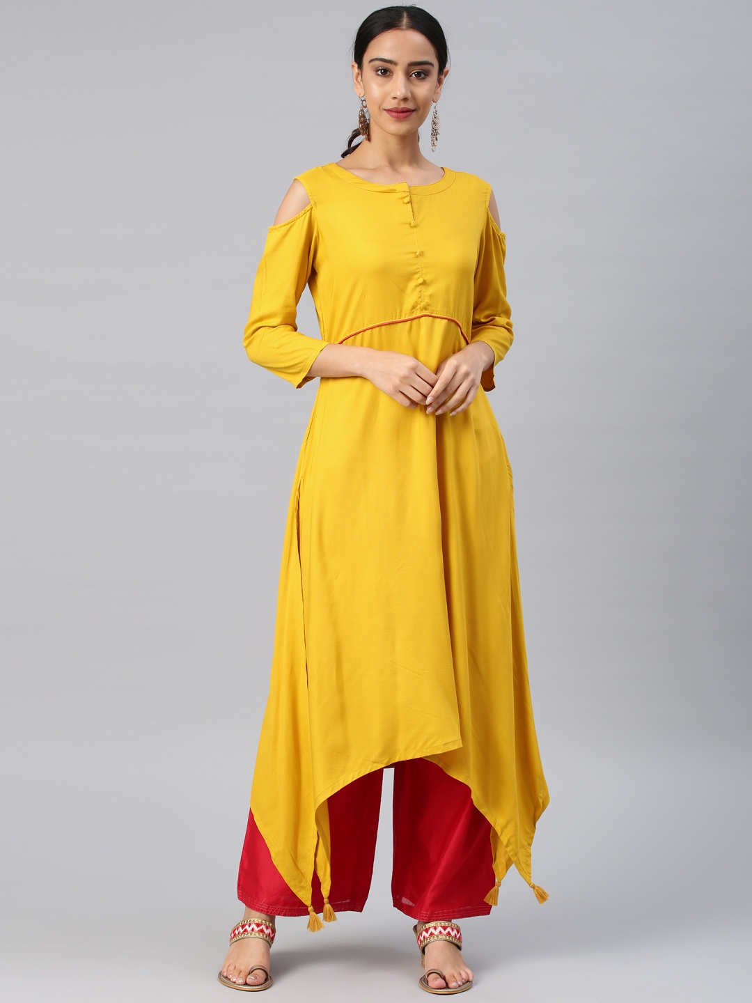 

Vishudh Women Mustard Solid Asymmetric A-Line Kurta