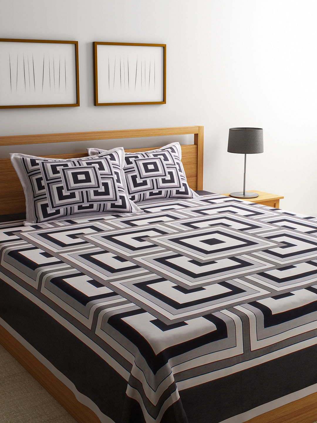 

Romee White & Black Printed Reversible 220 TC Bed Cover With 2 Pillow Covers