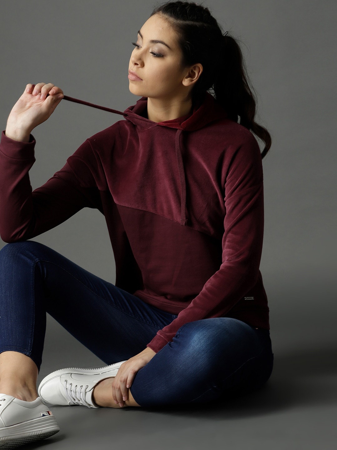 

Roadster Women Burgundy Solid Hooded Sweatshirt