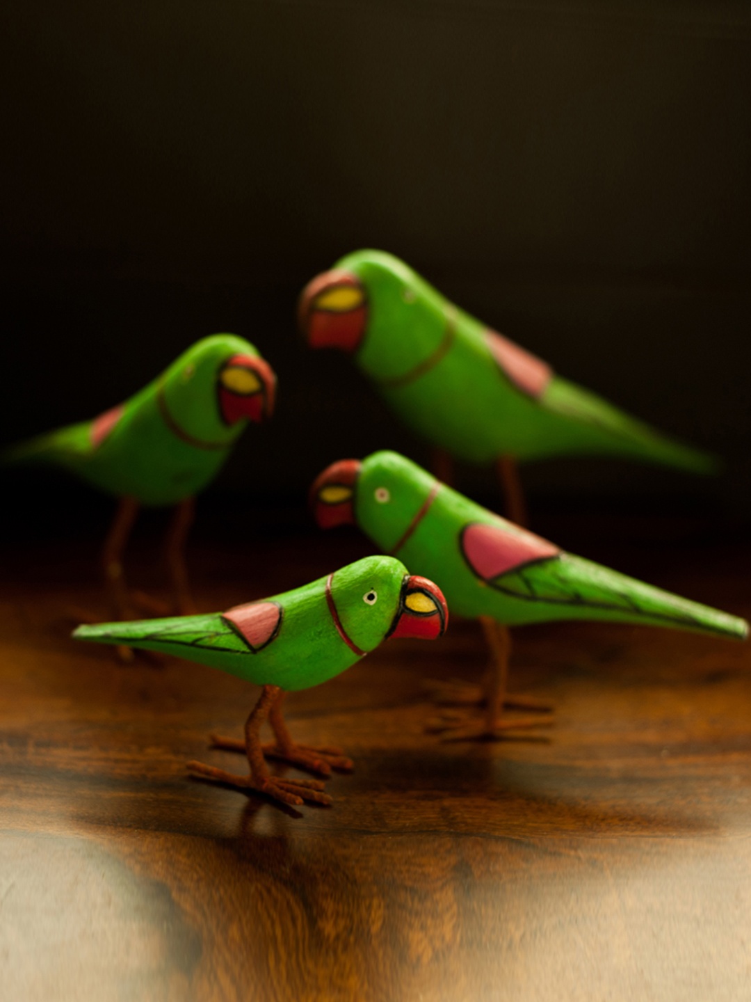 

ExclusiveLane Set of 4 Green Hand-Painted Parrot-Shaped Wooden Showpieces