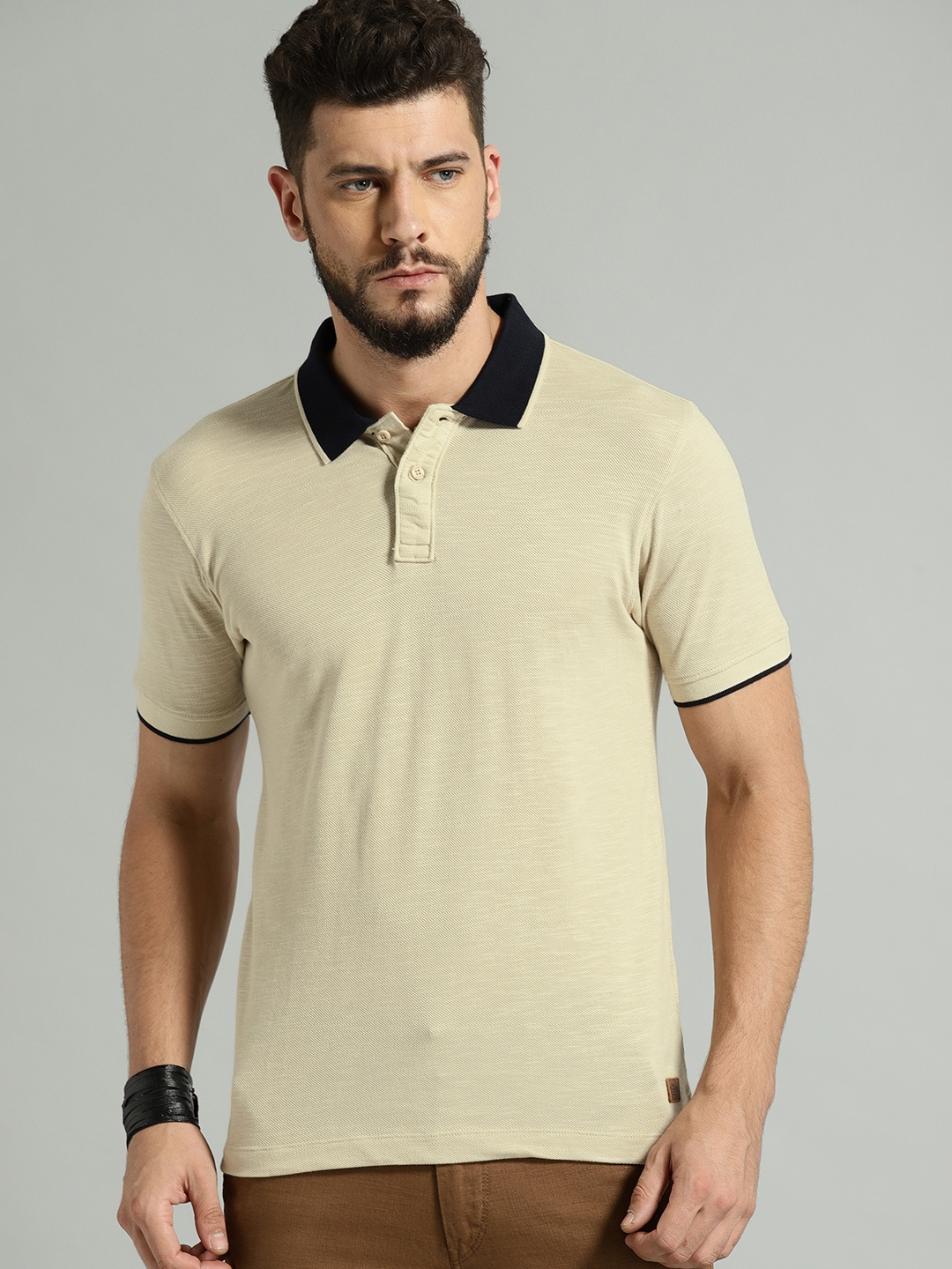 

Roadster Men Beige Solid Polo T-shirt