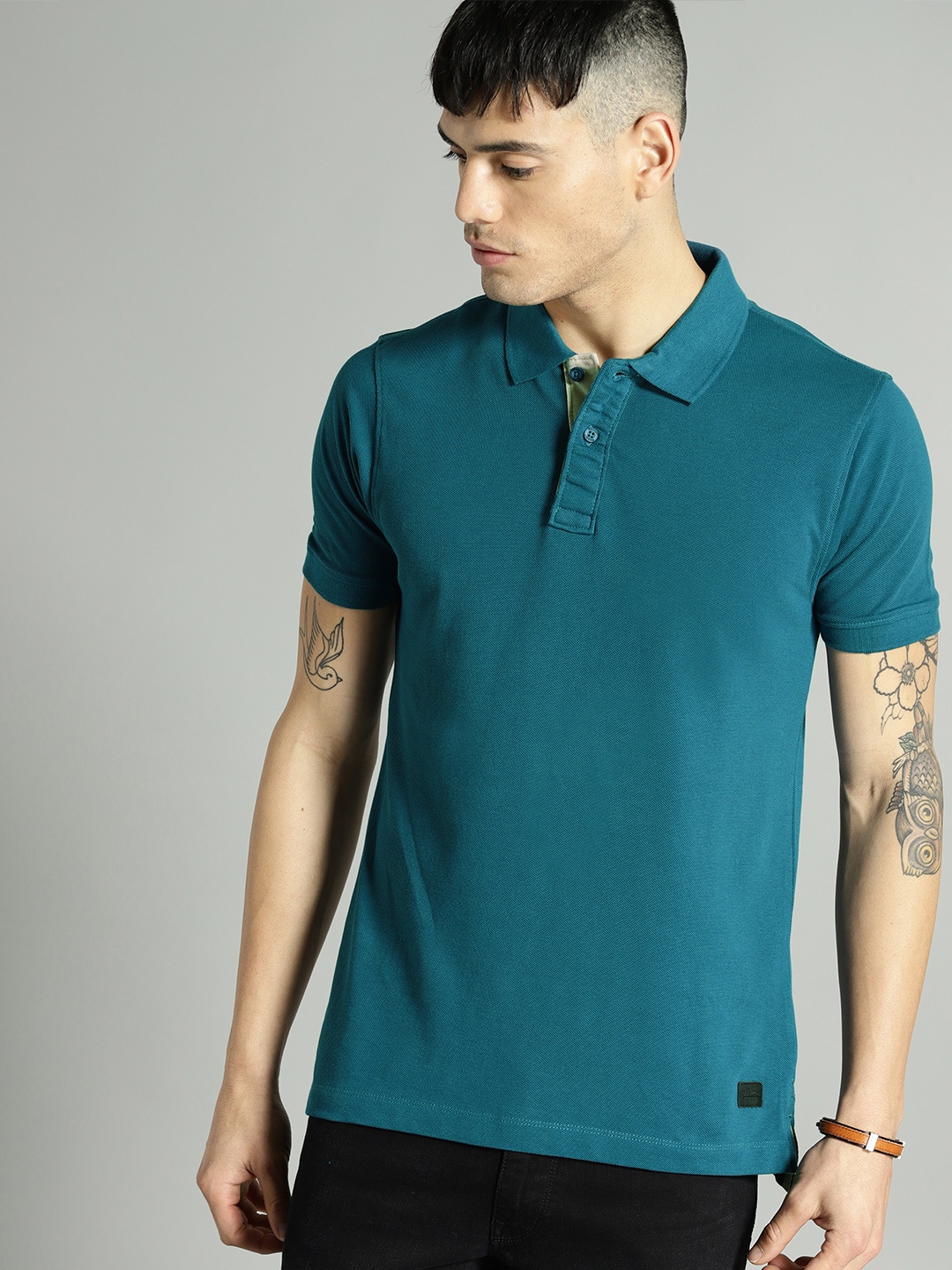 

Roadster Men Teal Blue Solid Polo Collar T-shirt