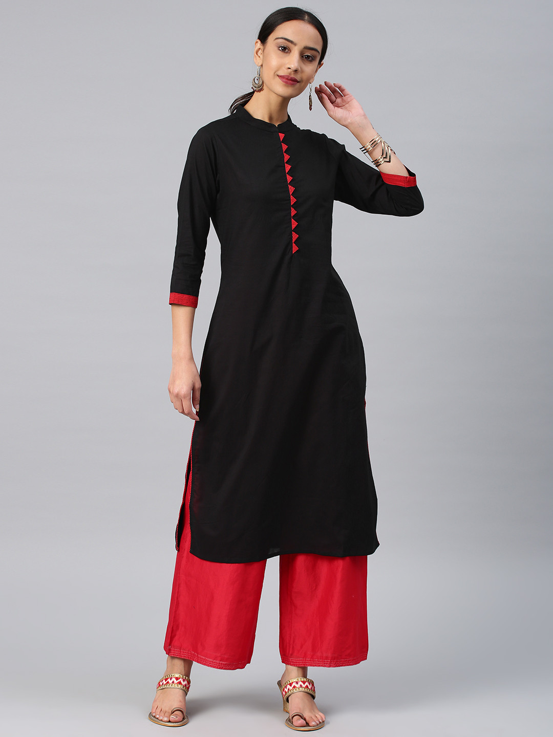 

Vishudh Women Black & Red Solid Straight Kurta