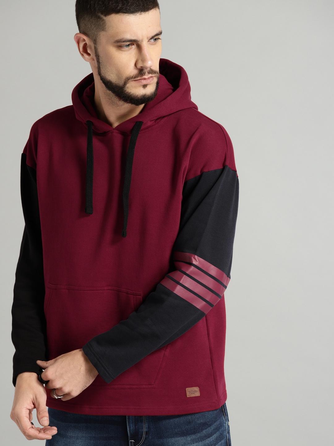 

Roadster Men Maroon & Navy Blue Solid Hooded Sweatshirt