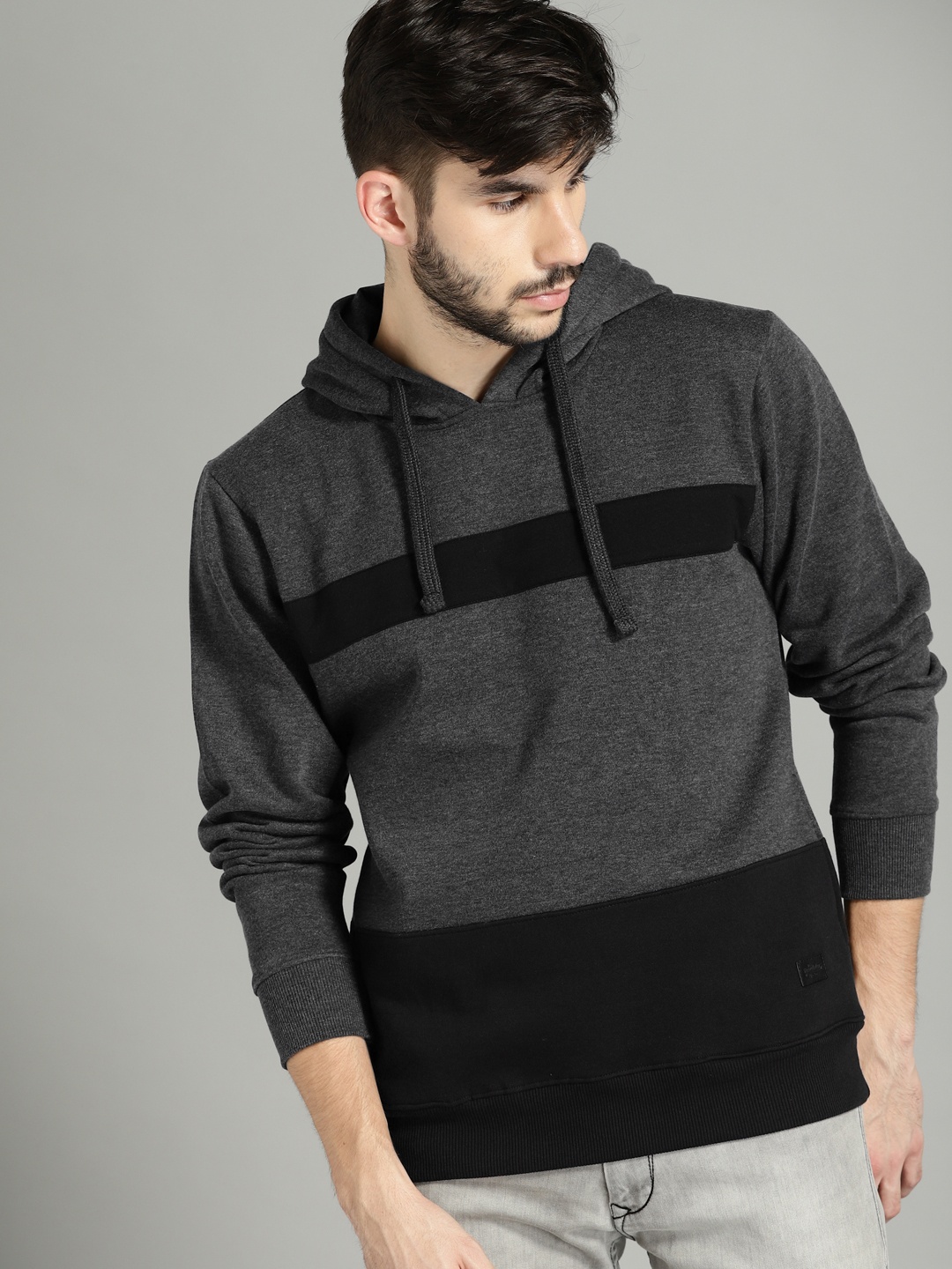 

Roadster Men Charcoal Grey & Black Colourblocked Hooded Sweatshirt