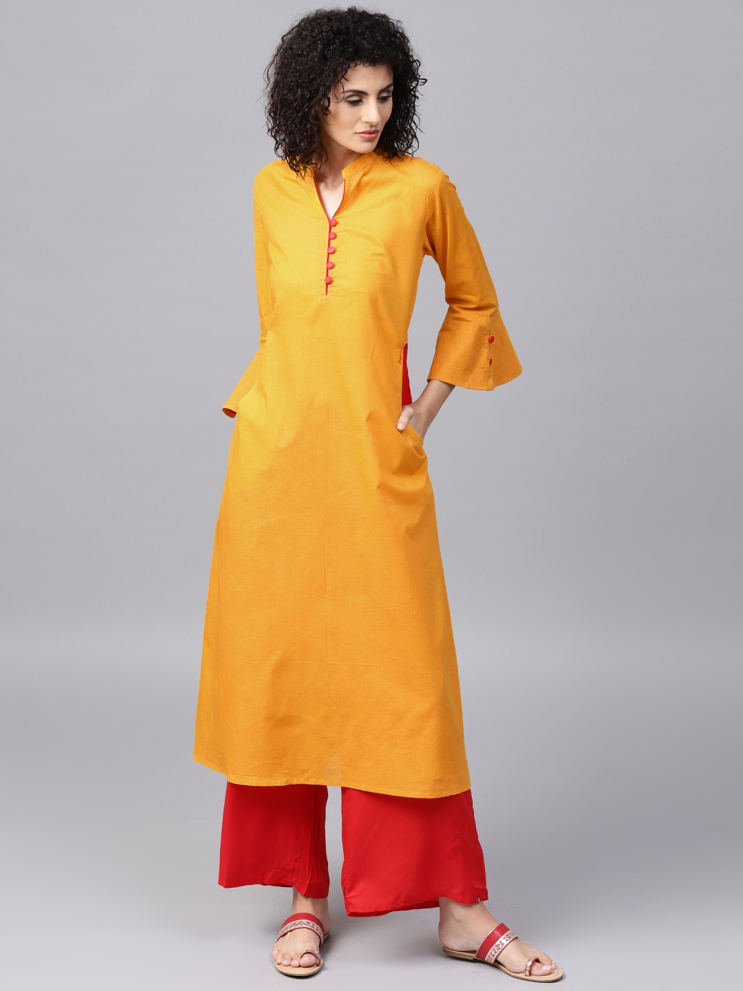 

Tulsattva Women Yellow Solid Straight Kurta