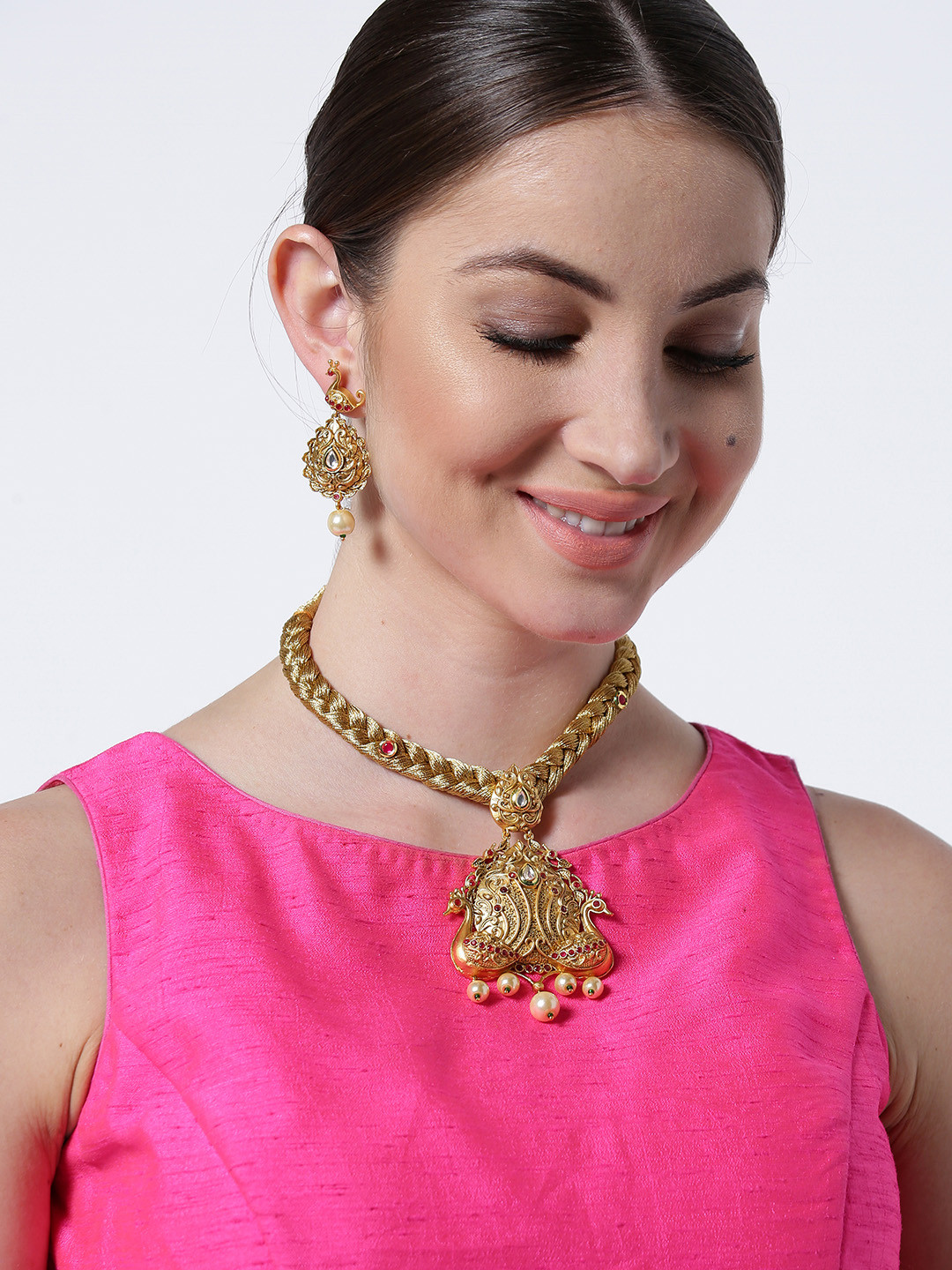 

Priyaasi Gold-Toned & Pink Peacock Shaped Jewellery Set