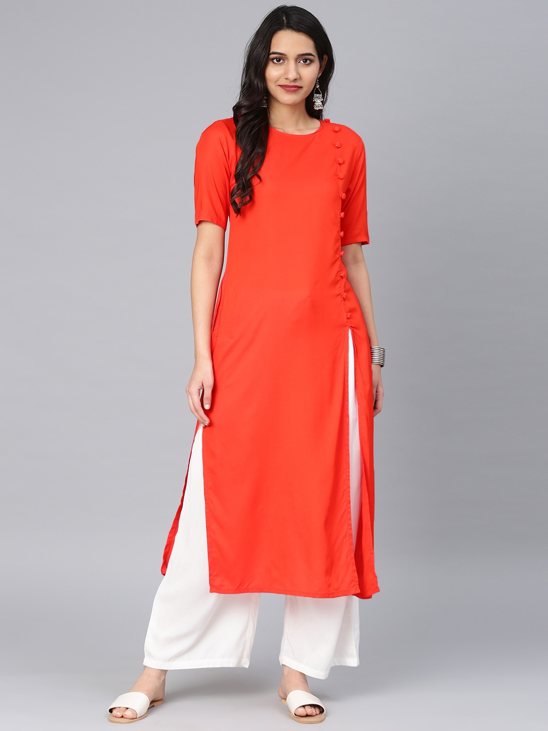 

Vishudh Women Orange Solid Straight Kurta