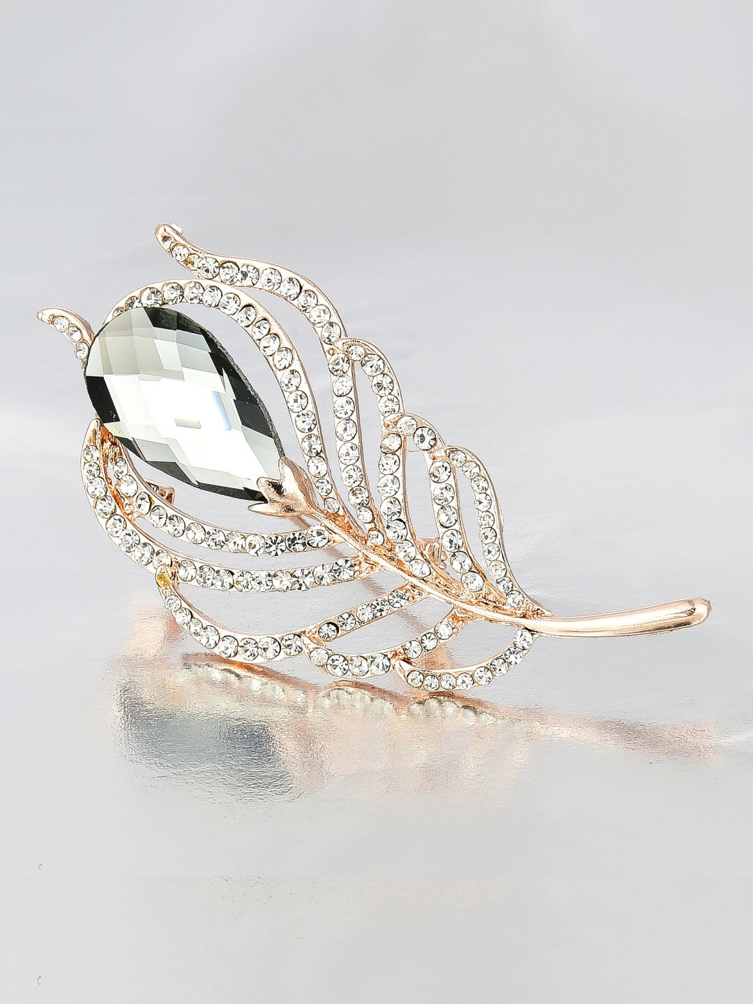 

Crunchy Fashion Women Gold-Toned & Grey Stone-Studded Leaf-Shaped Brooch