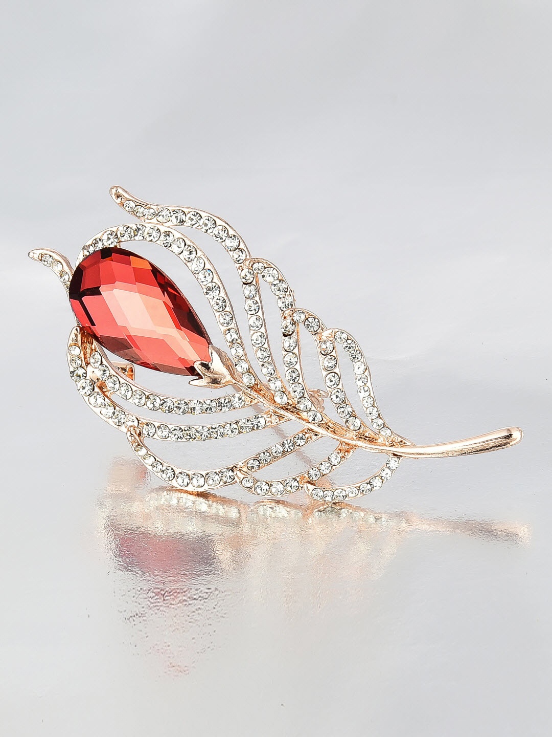 

Crunchy Fashion Women Gold-Toned & Brown Stone-Studded Feather Leaf-Shaped Brooch
